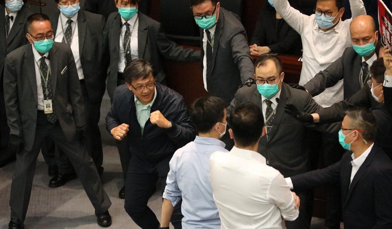 Lawmaker Junius Ho with his fists up as he confronts opponents. Photo: Dickson Lee