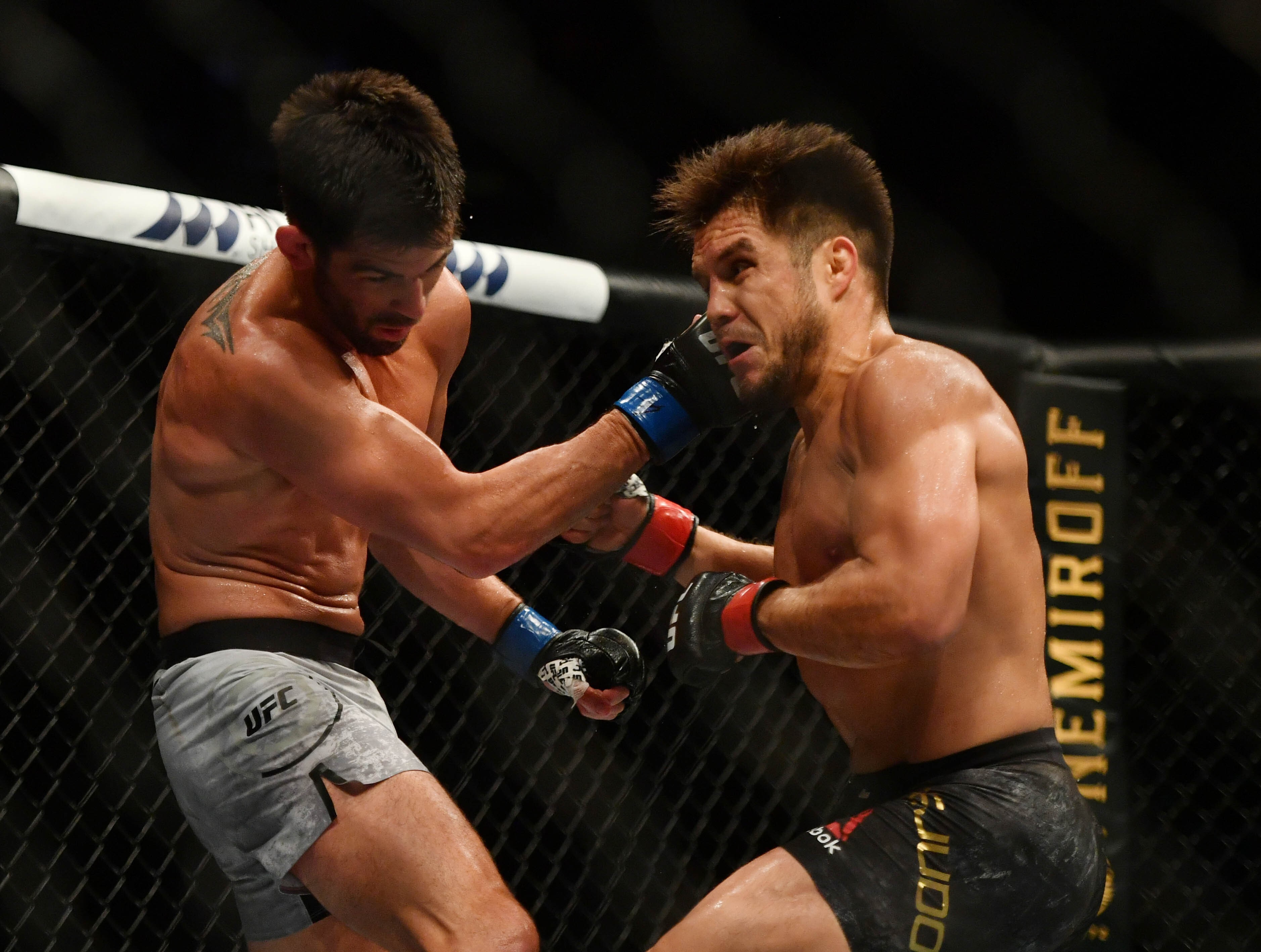 Henry Cejudo exchanges with Dominick Cruz at UFC 249. Photo: USA TODAY Sports