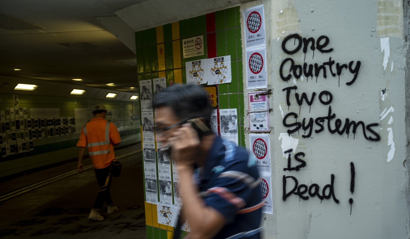 One commentator argued that the anti-government protests in Hong Kong showed peaceful unification under “one country, two systems” was impossible. Photo: Warton Li