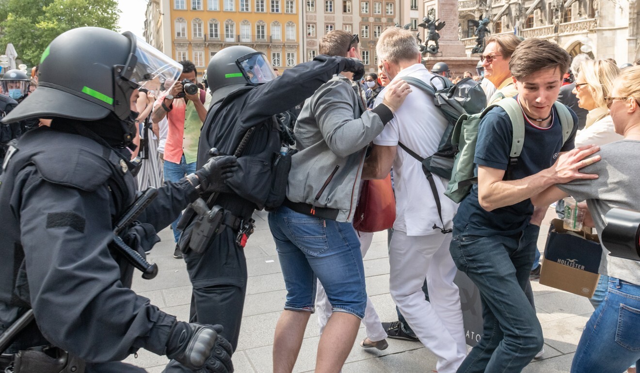 Police officers clash with protesters in Munich following a demonstration on Saturday against coronavirus lockdown restrictions. Photo: dpa
