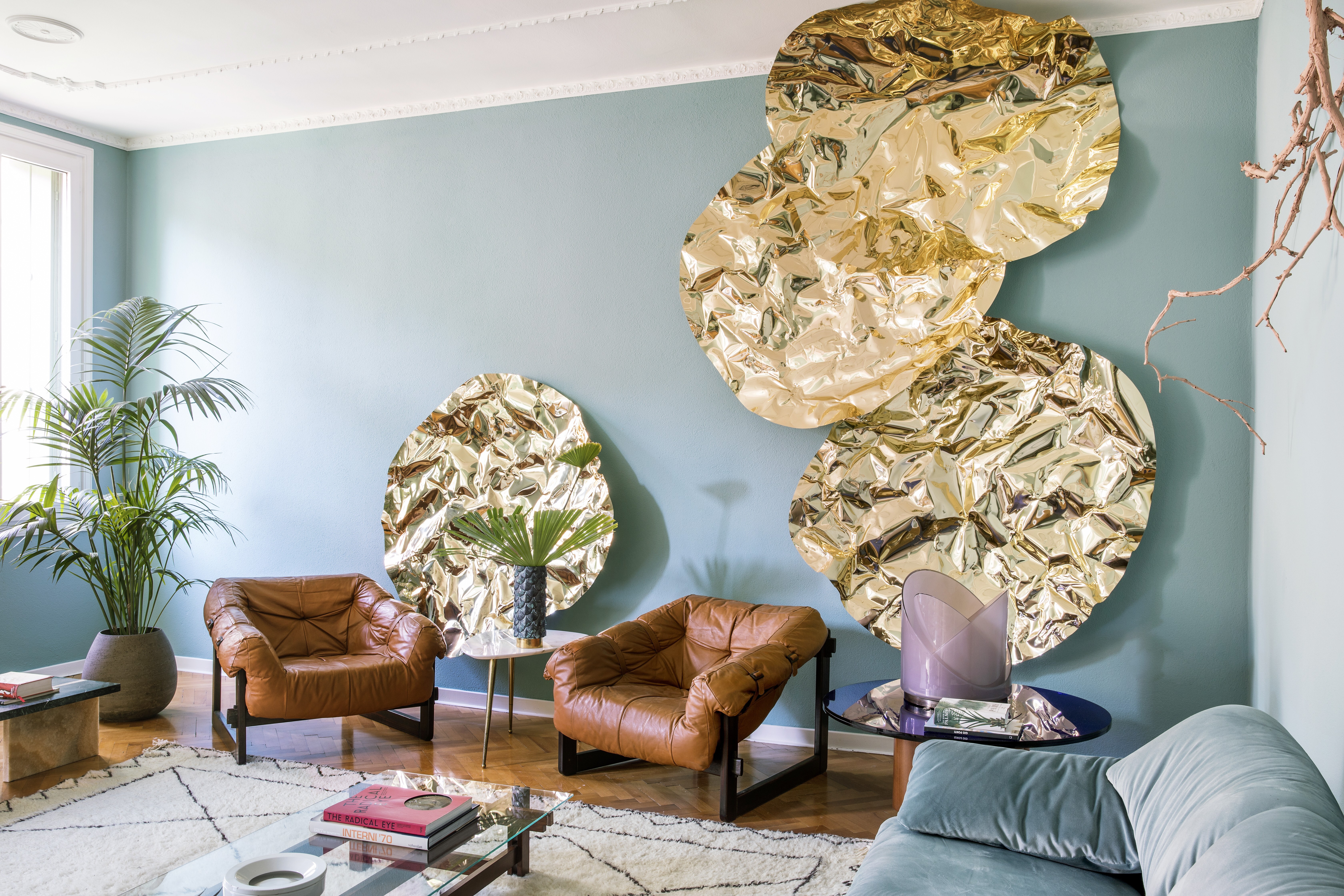 Golden artworks stand out in the living room of Vicenza native Giacomo Totti’s home. Photos: Helenio Barbetta/Living Inside