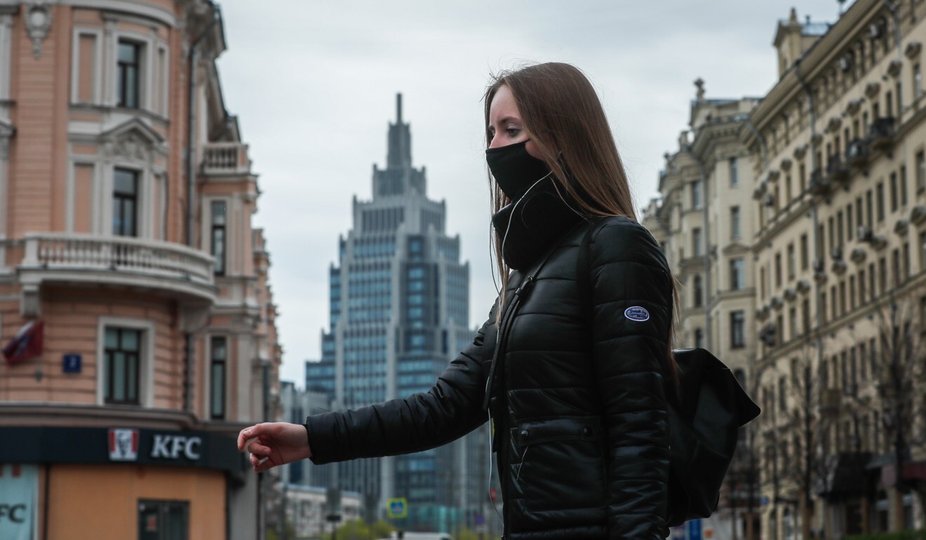 A woman wears a protective face mask in downtown Moscow. Photo: EPA-EFE