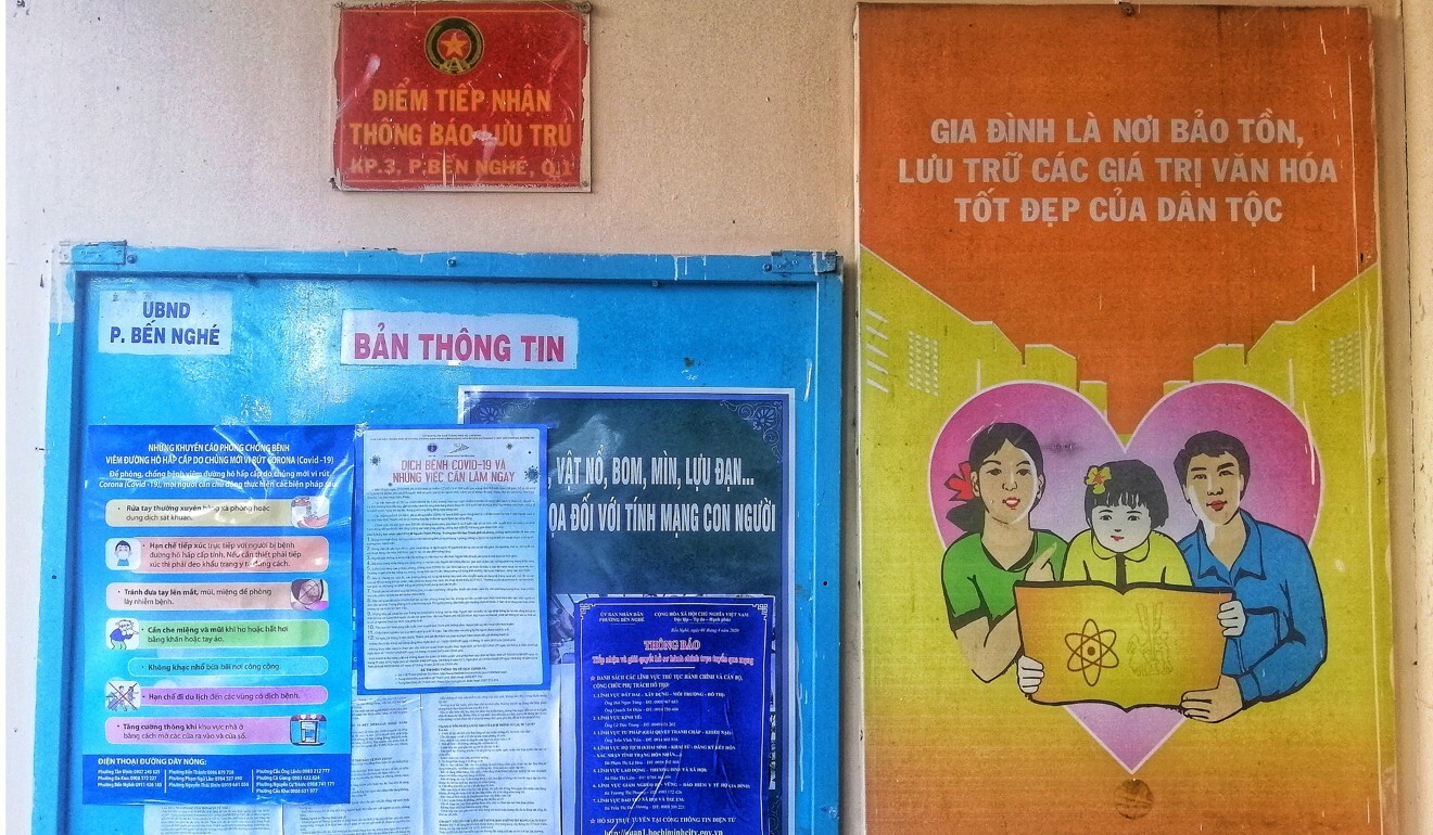 A poster (right) in Ho Chi Minh City reads: ‘Family is the reservoir of our nation’s beautiful cultural values’. Photo: Sen Nguyen