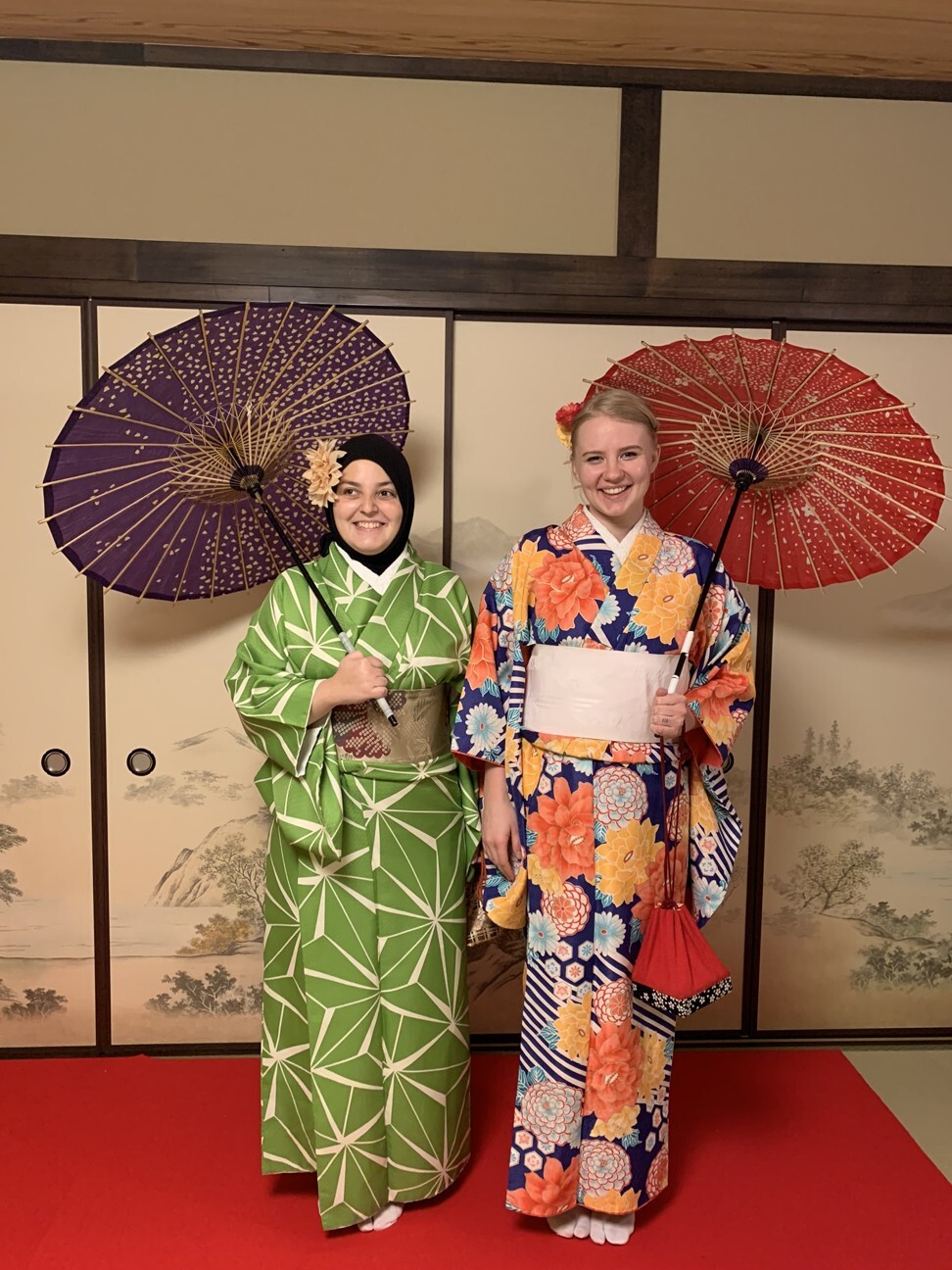 Minkara and Guse wearing brightly coloured kimonos after a traditional Japanese tea ceremony in Tokyo. Photo: courtesy of Mona Minkara