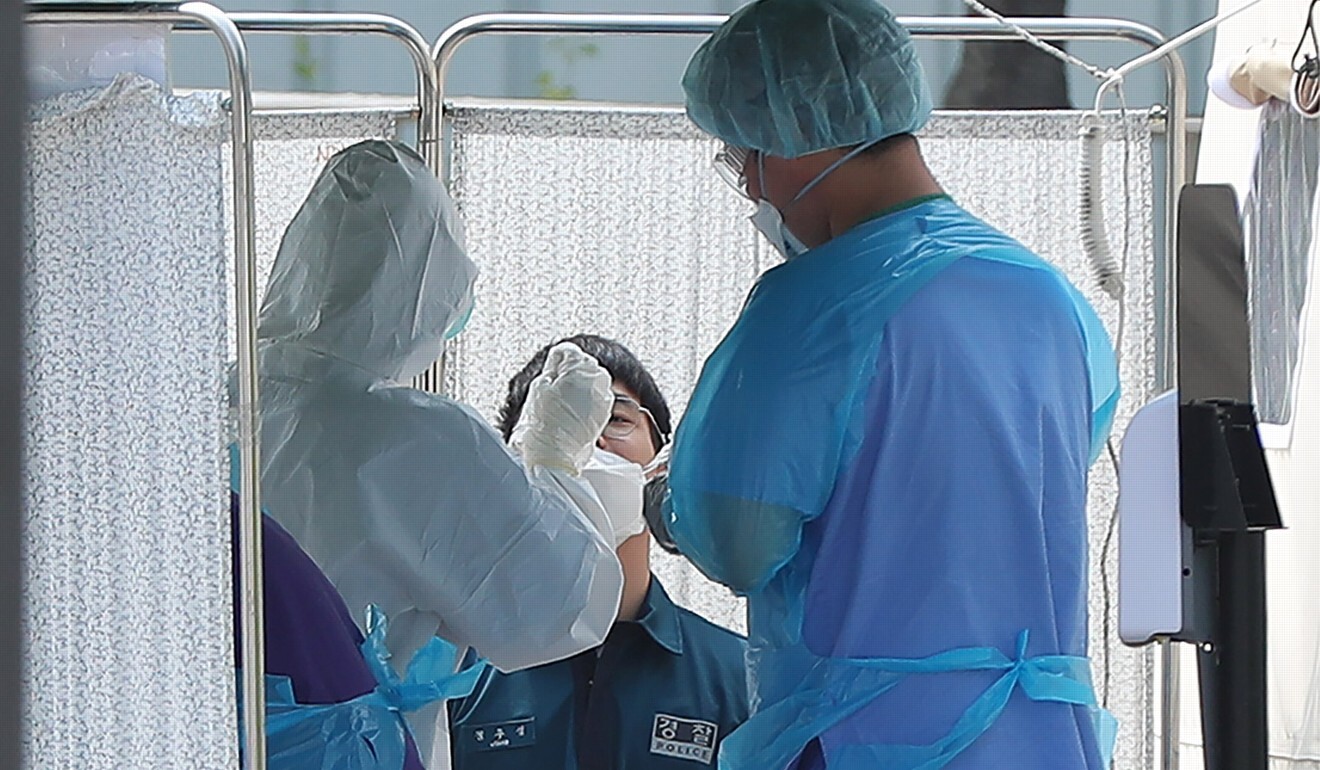 A person receives a Covid-19 test at a makeshift clinic in Seoul. Photo: YNA/dpa