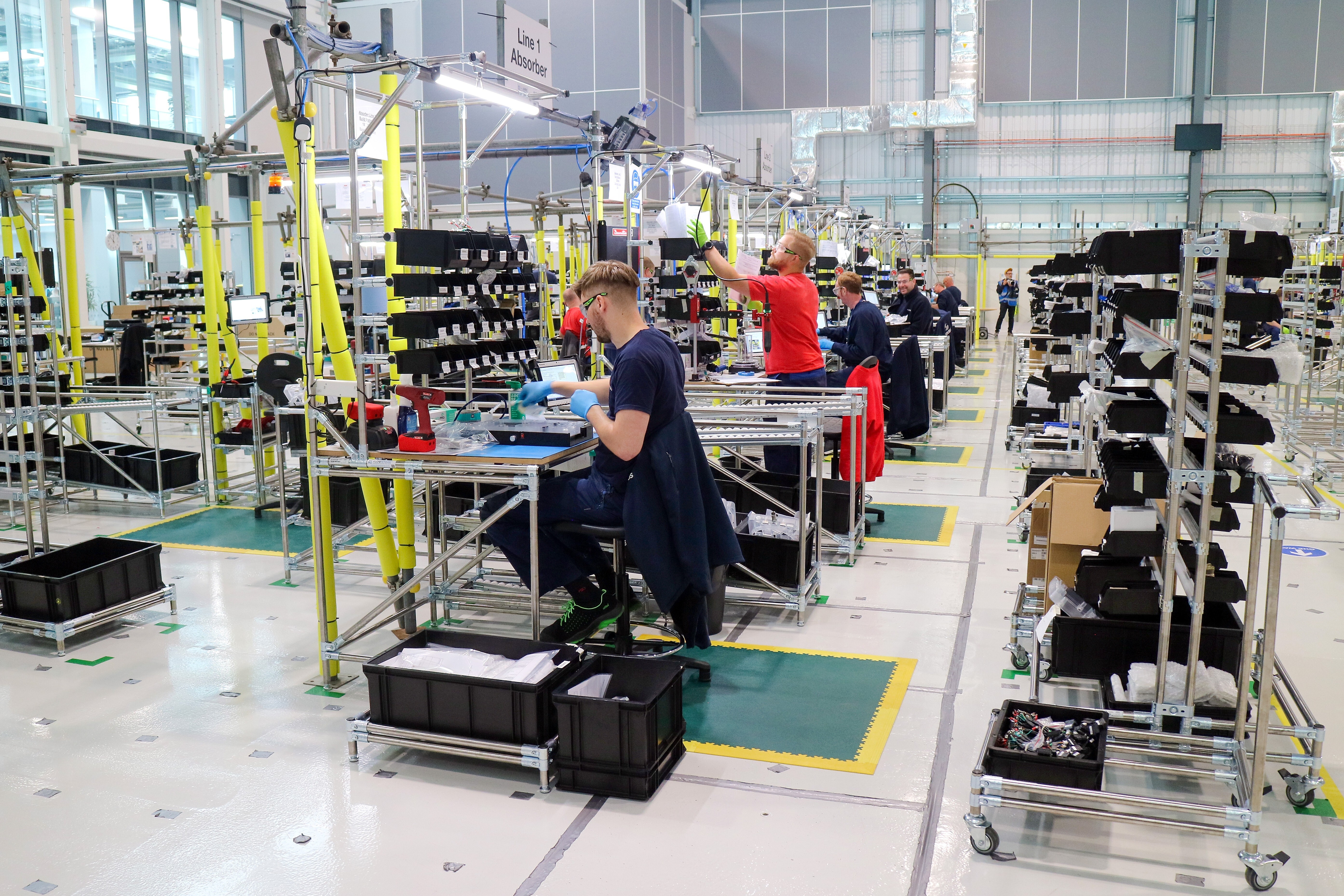 Employees work on a ventilator production line in an adapted hangar at an Airbus SE assembly plant in Broughton, Britain, on April 30. Industrial giants like Airbus are lending their factory floors to meet government orders. Photo: Bloomberg