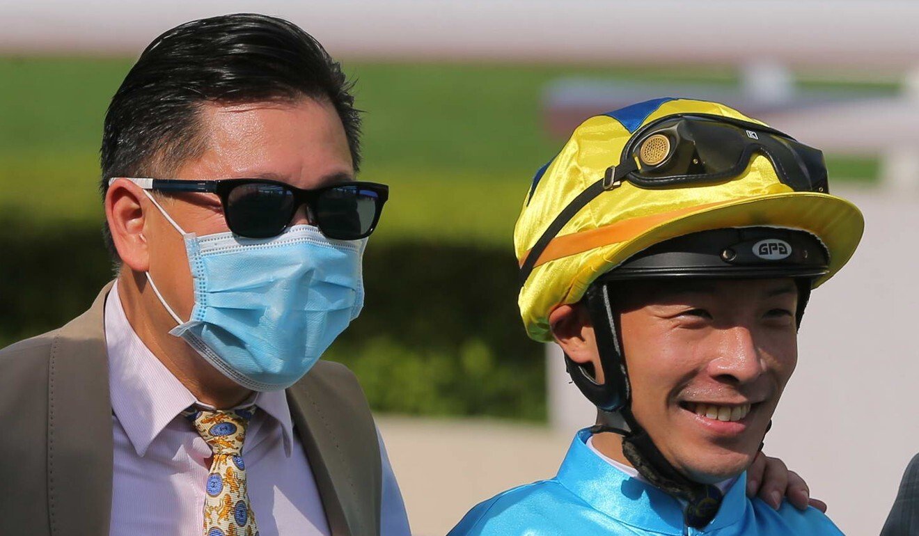 Trainer Dennis Yip and jockey Ben So celebrate their victory.