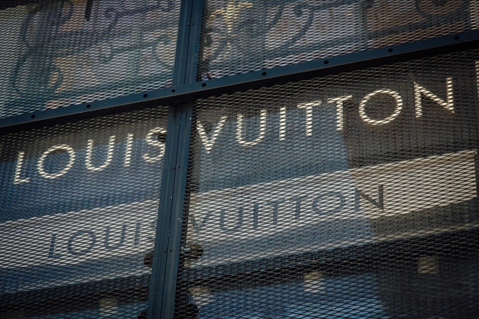 Metal security grilles protect the closed Louis Vuitton luxury store in Paris this week. Photo: Bloomberg