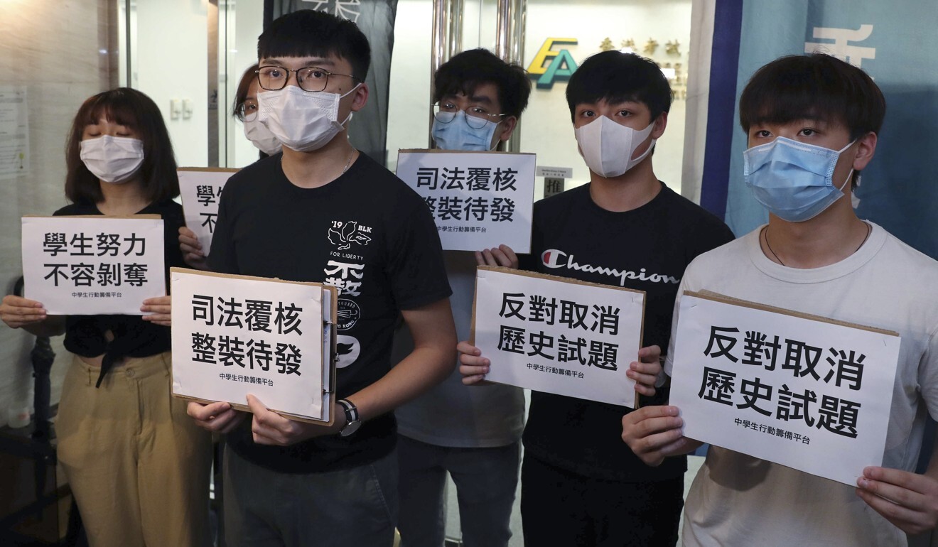 Members of Demosisto petition outside the exam authority’s office in Wan Chai on Monday. Photo: Sam Tsang