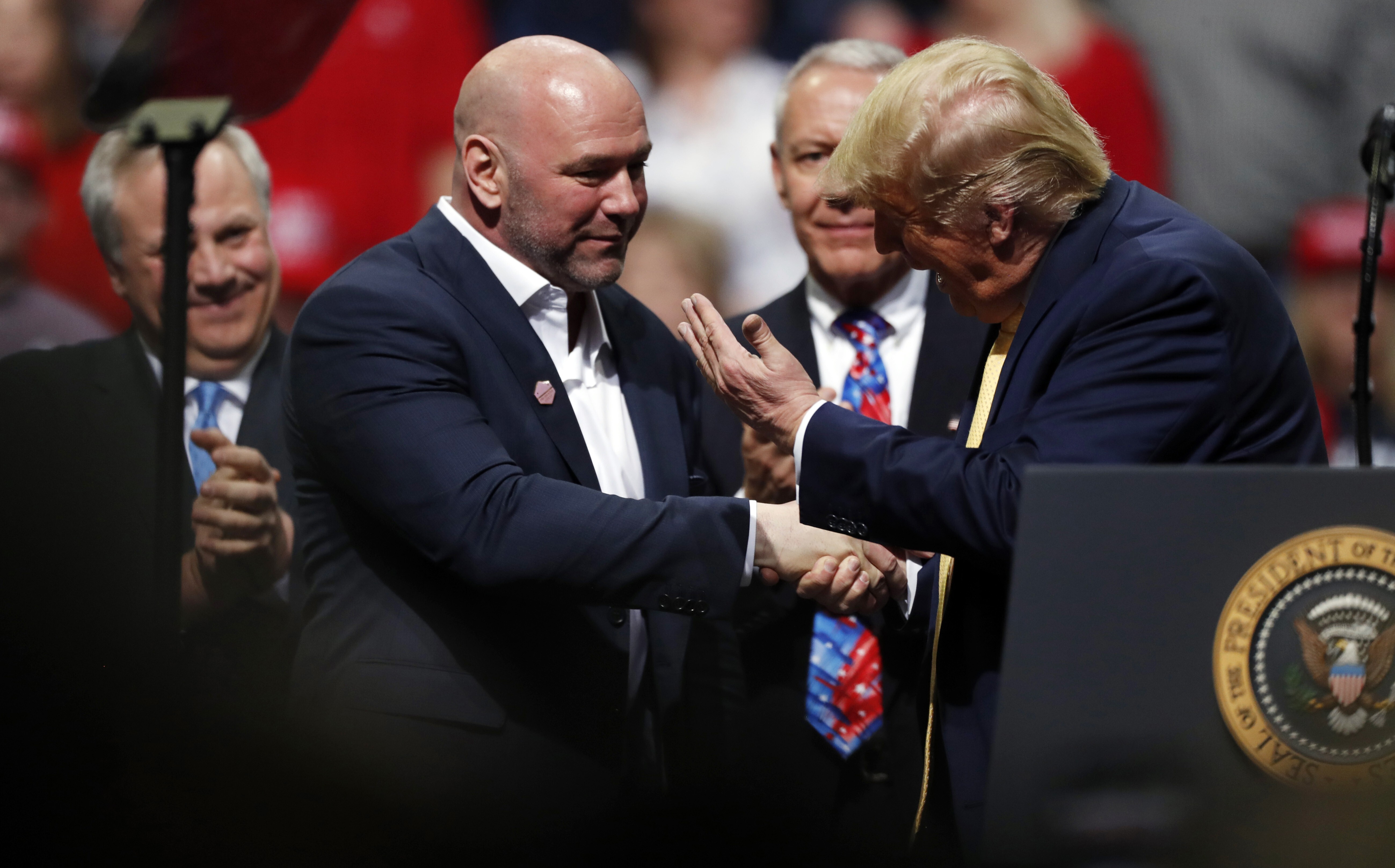 President Donald Trump greets UFC president Dana White at a campaign rally in Colorado in February. Photo: AP