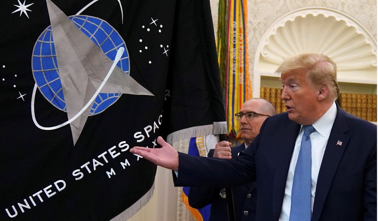 US President Donald Trump was presented with the new Space Force flag last week. Photo: Reuters