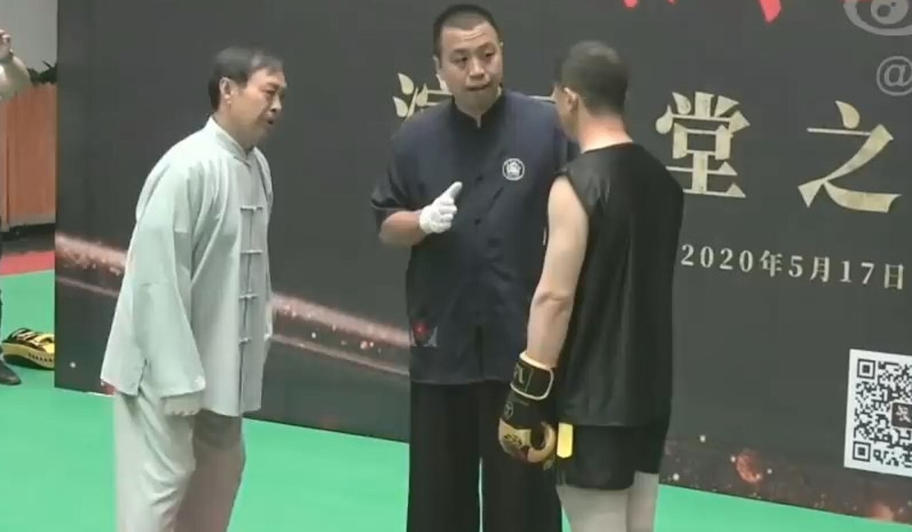Ma Baoguo and Wang Qingmin are explained the rules by the ref. Photo: YouTube