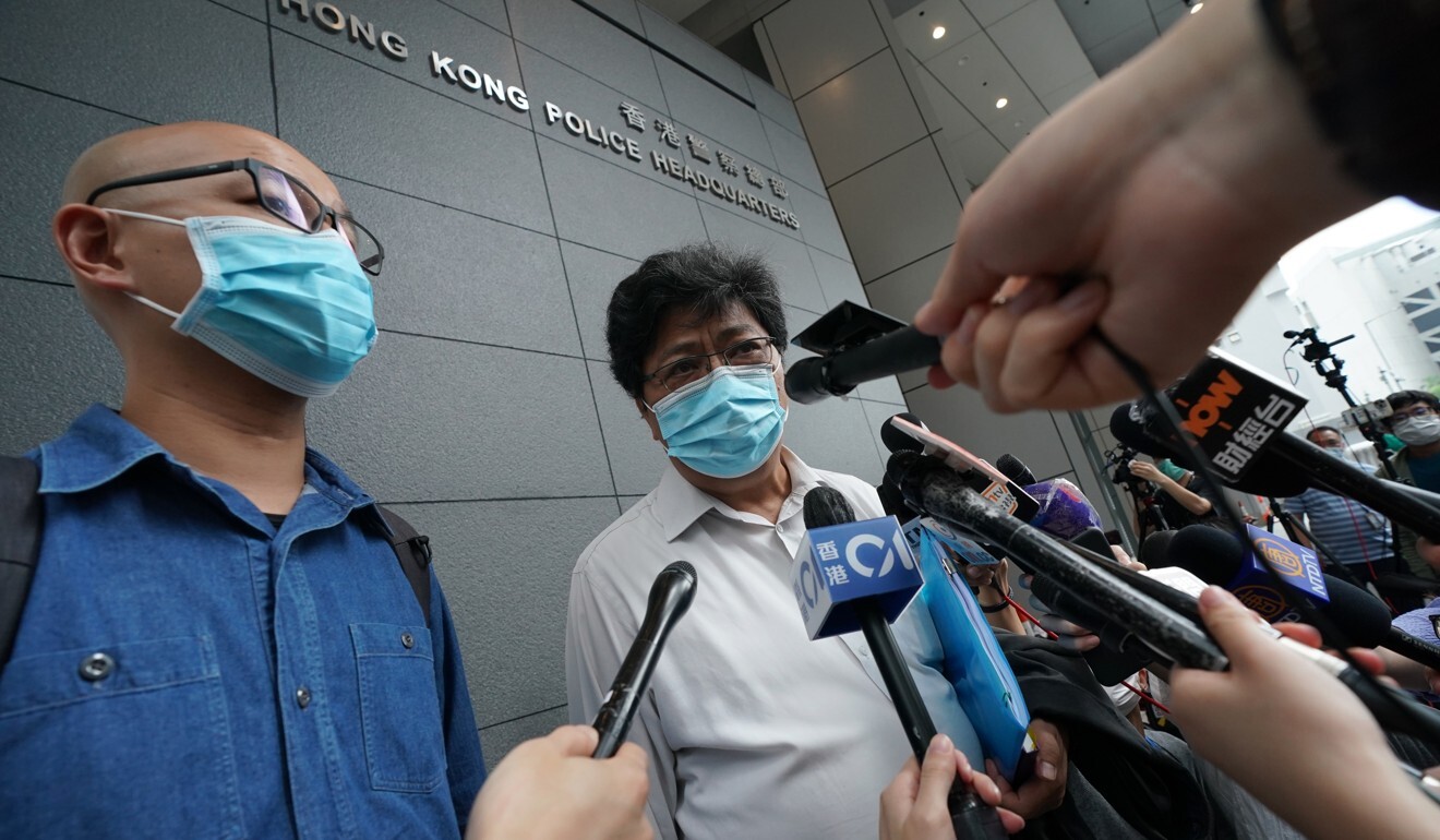 Chan Yik-chiu (left), chairman of the Hong Kong Press Photographers Association and Chris Yeung, head of the Hong Kong Journalists Association, speak to the press before the meeting with police chief Chris Tang at Police Headquarters in Wan Chai. Photo: Felix Wong