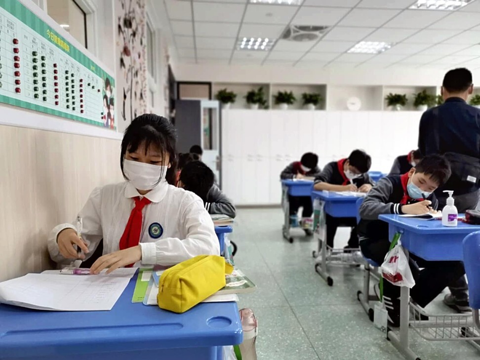 Schools in China are restarting. In Shanghai, students check their temperatures three times a day. Photo: AFP