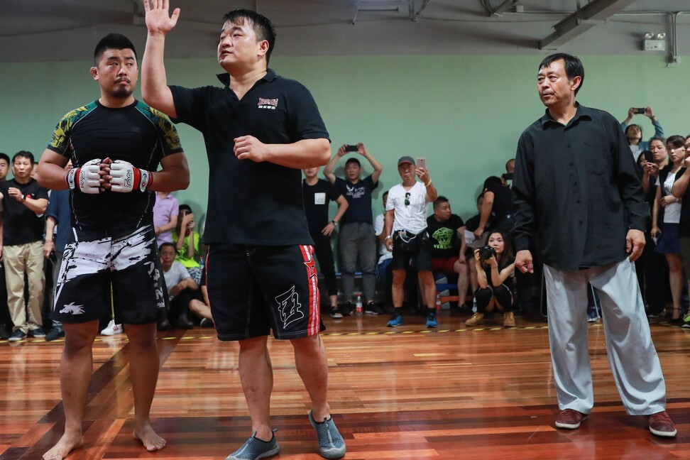 Xu Xiaodong (left) prepares to compete against Ma Baoguo (right), a master of Chen-style tai chi, in Shanghai before police shut down the event in June 2017. Photo: Imaginechina via AFP