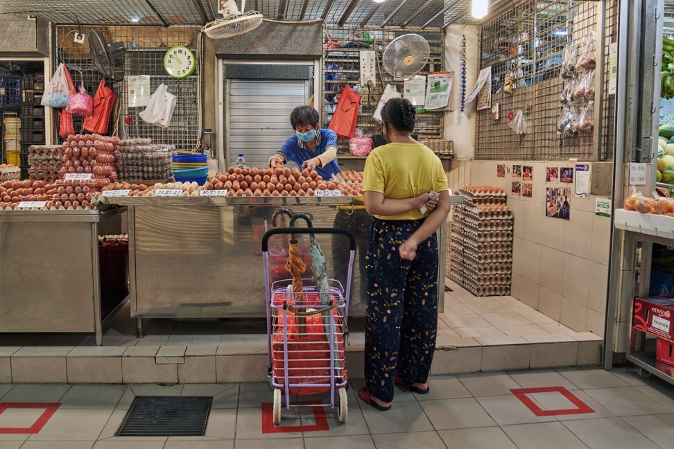 A customer shops at a market in Singapore on May 20, 2020. Photo: Bloomberg