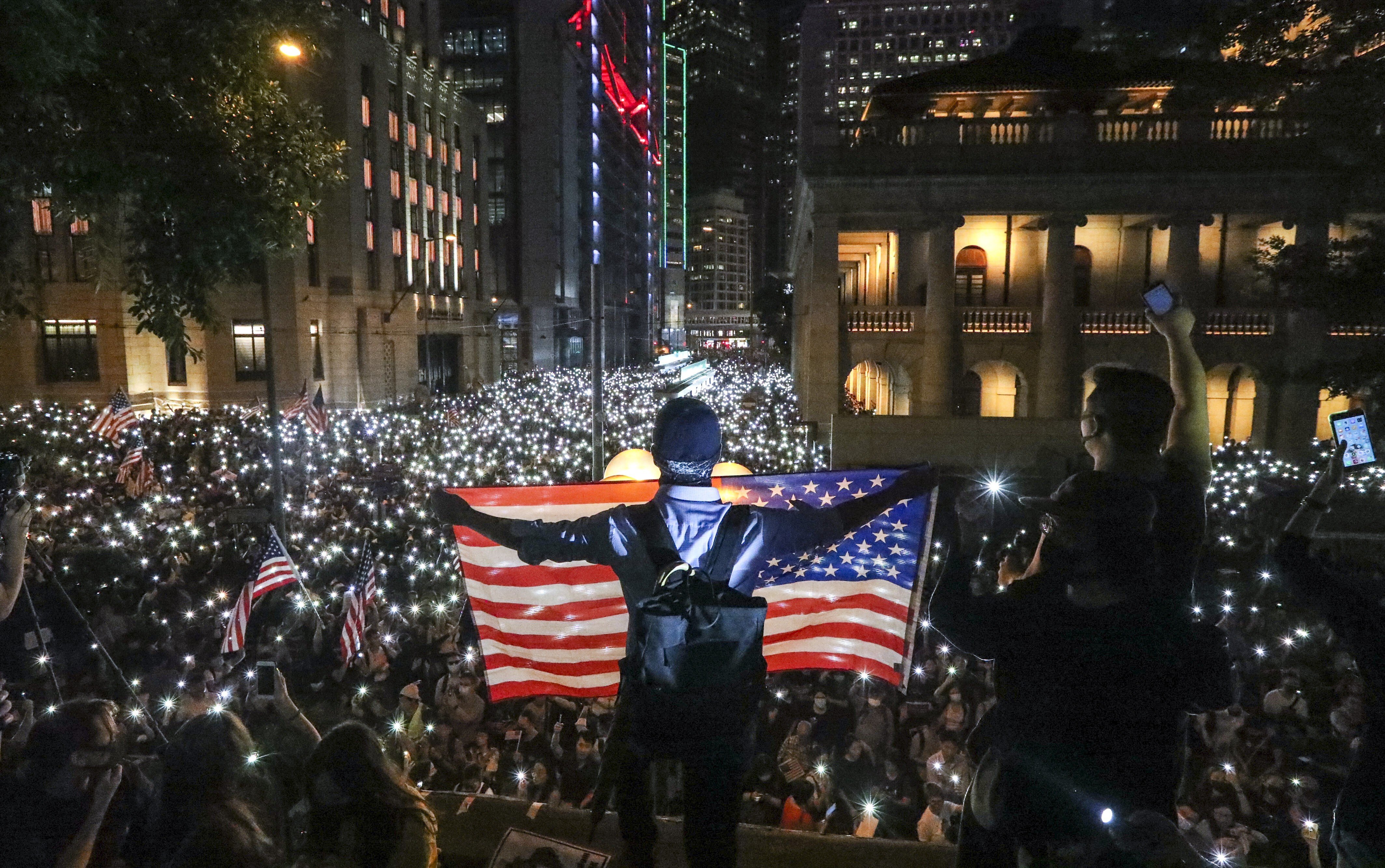 Anti-government protesters wave a US flag during an October 2019 protest in Central. Photo: Felix Wong