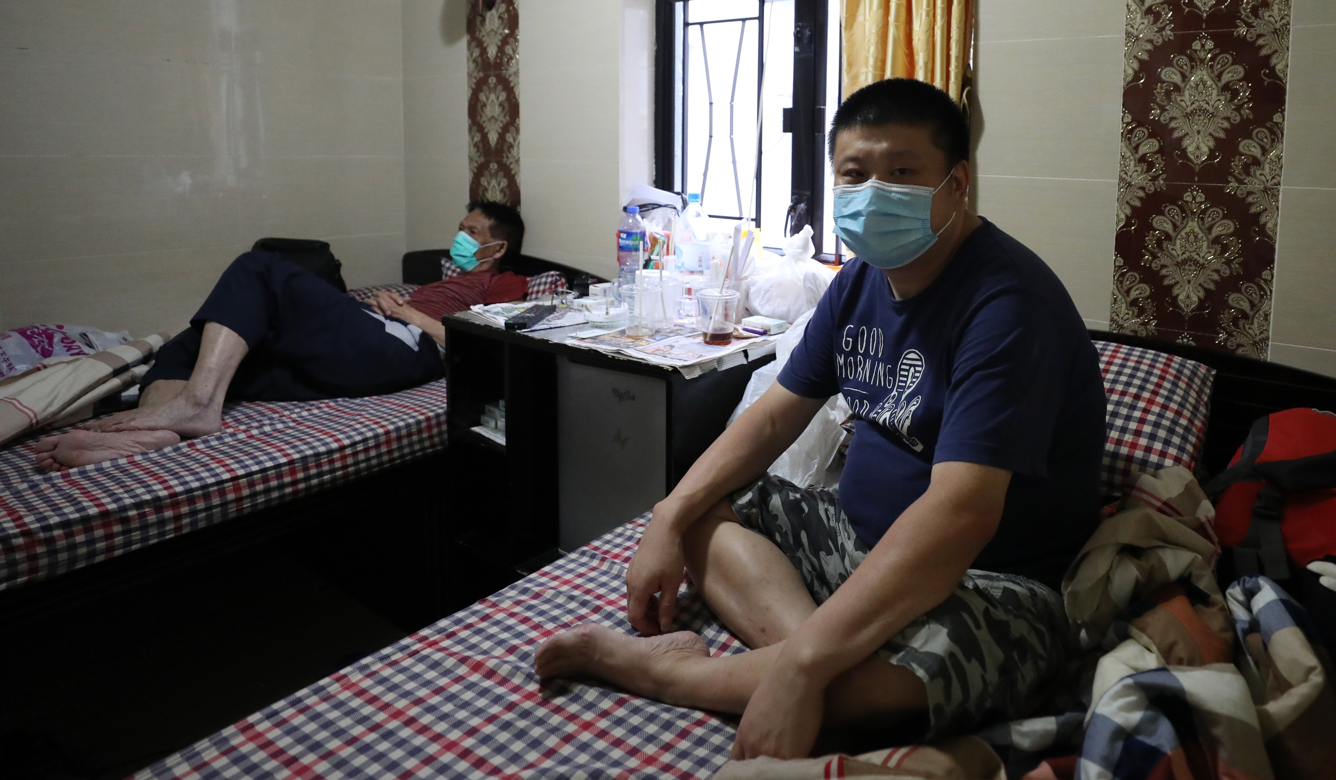 Chu Lui, who lived in Shenzhen and worked in Hong Kong before the coronavirus pandemic, in his room at Chungking Mansions, Tsim Sha Tsui. Photo: Nora Tam