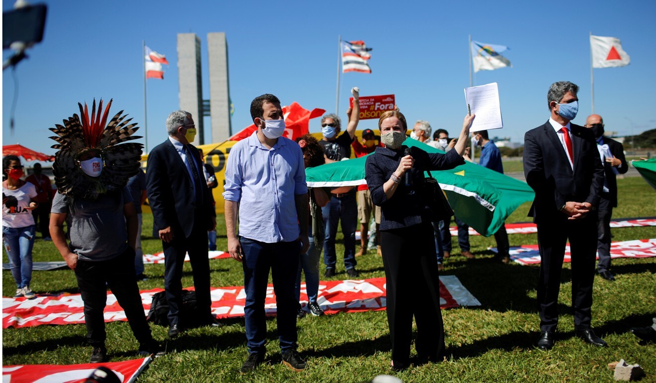 Members of the congress show the request of impeachment against Brazil's President Jair Bolsonaro during a protest against him in Brasilia. Photo: Reuters