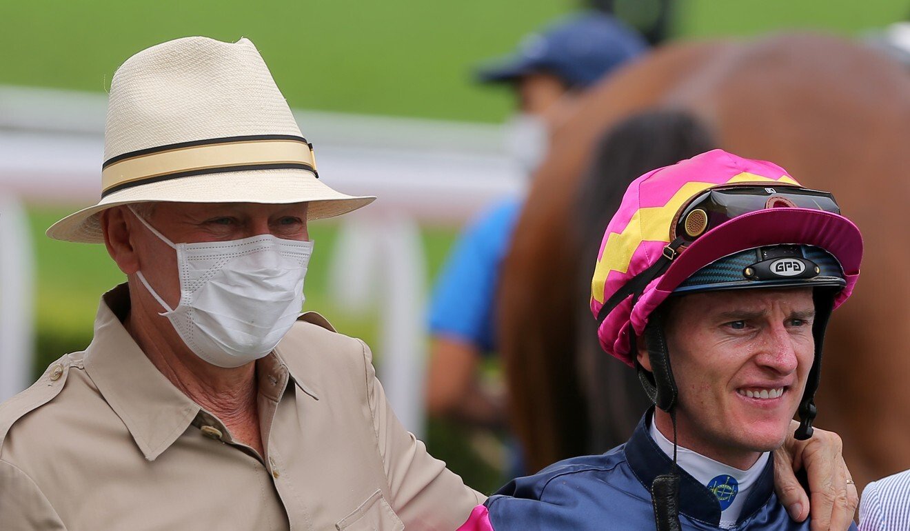 Trainer John Moore and jockey Zac Purton celebrate Thanks Forever’s win.