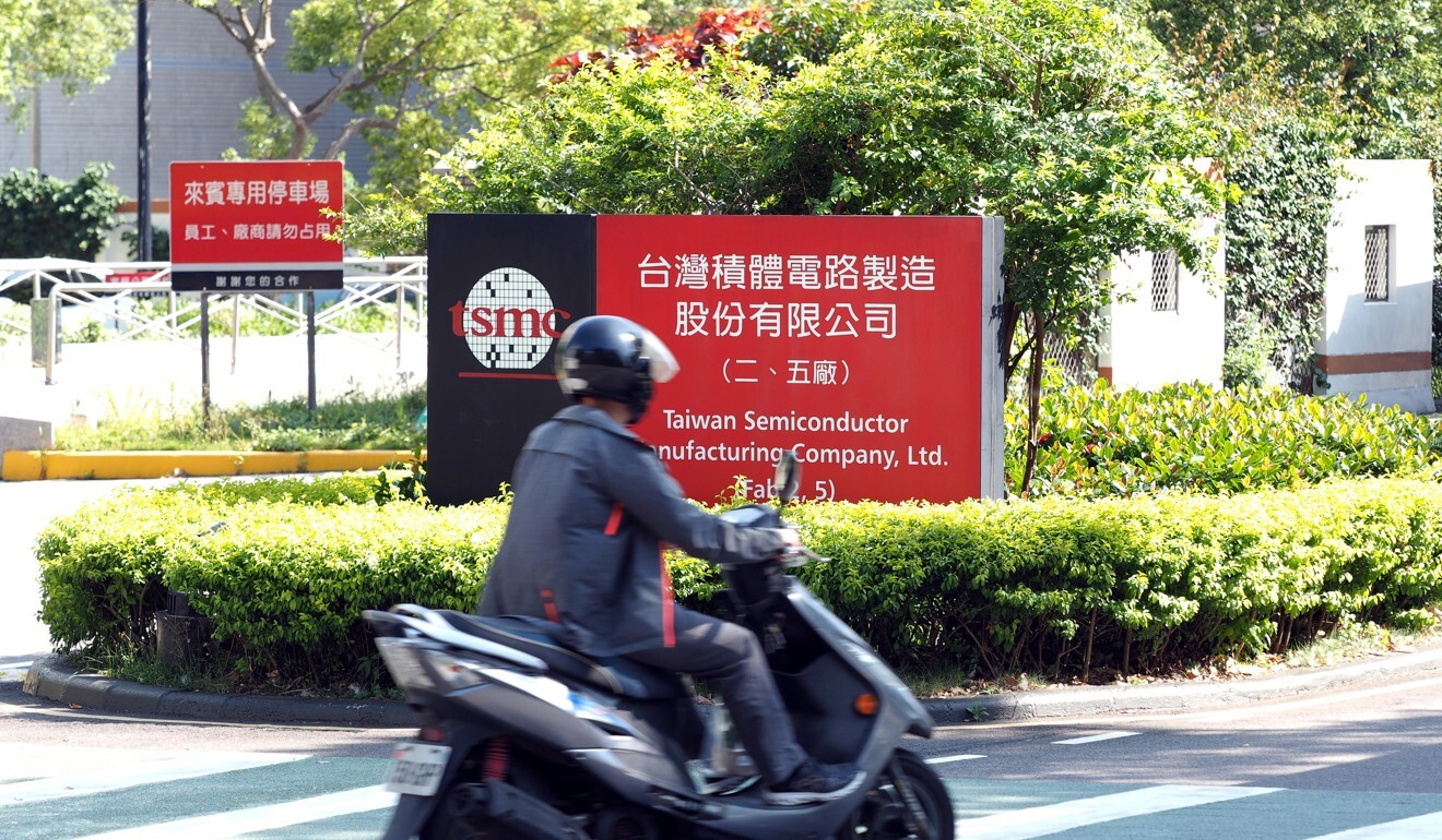A biker passes a factory of TSMC in Hsinchu, Taiwan, 15 May 2020. Photo: EPA-EFE