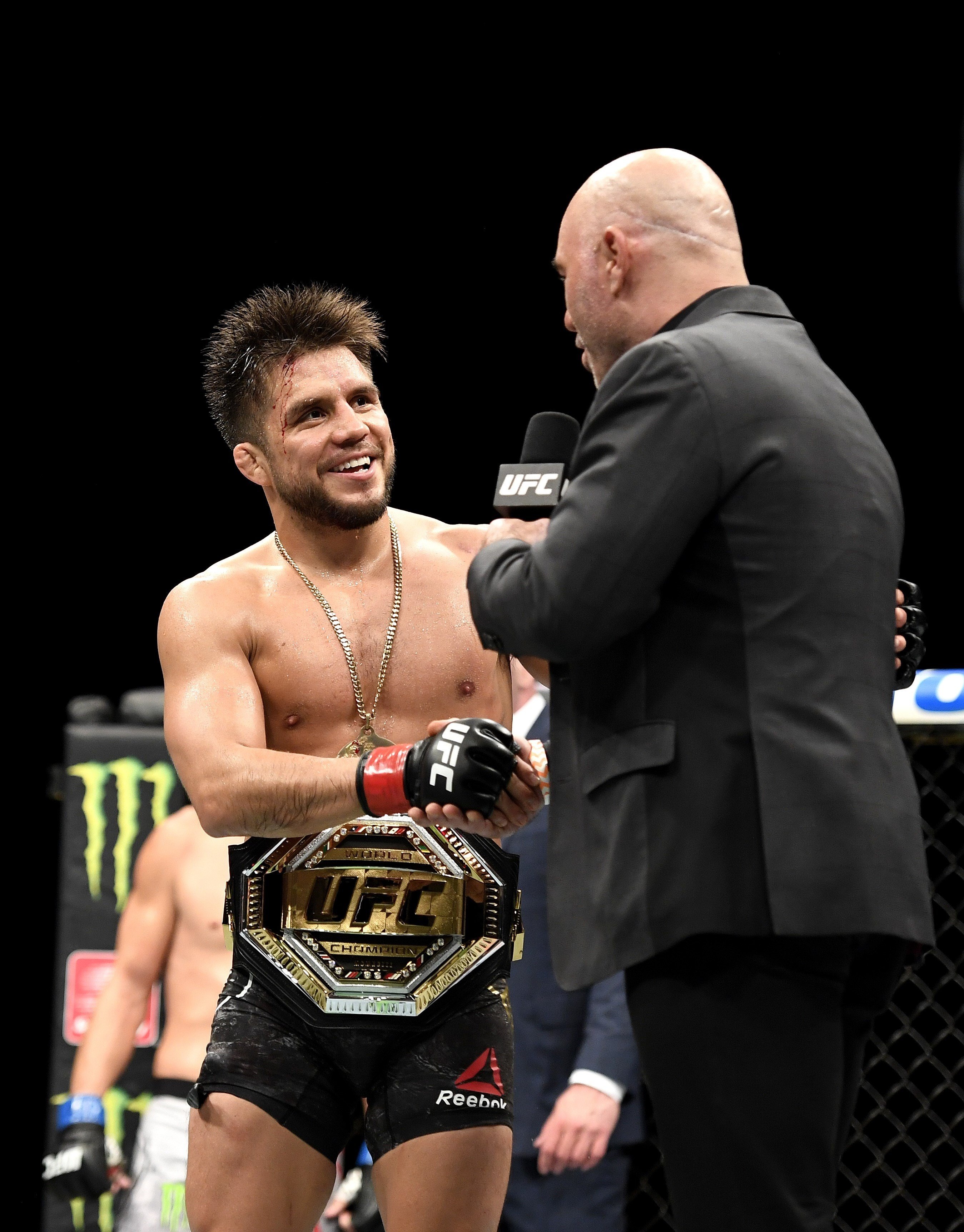 Henry Cejudo shakes hands with UFC analyst Joe Rogan after defending his bantamweight title against Dominick Cruz at UFC 249 at the VyStar Veterans Memorial Arena in Jacksonville, Florida in May. Photo: AFP