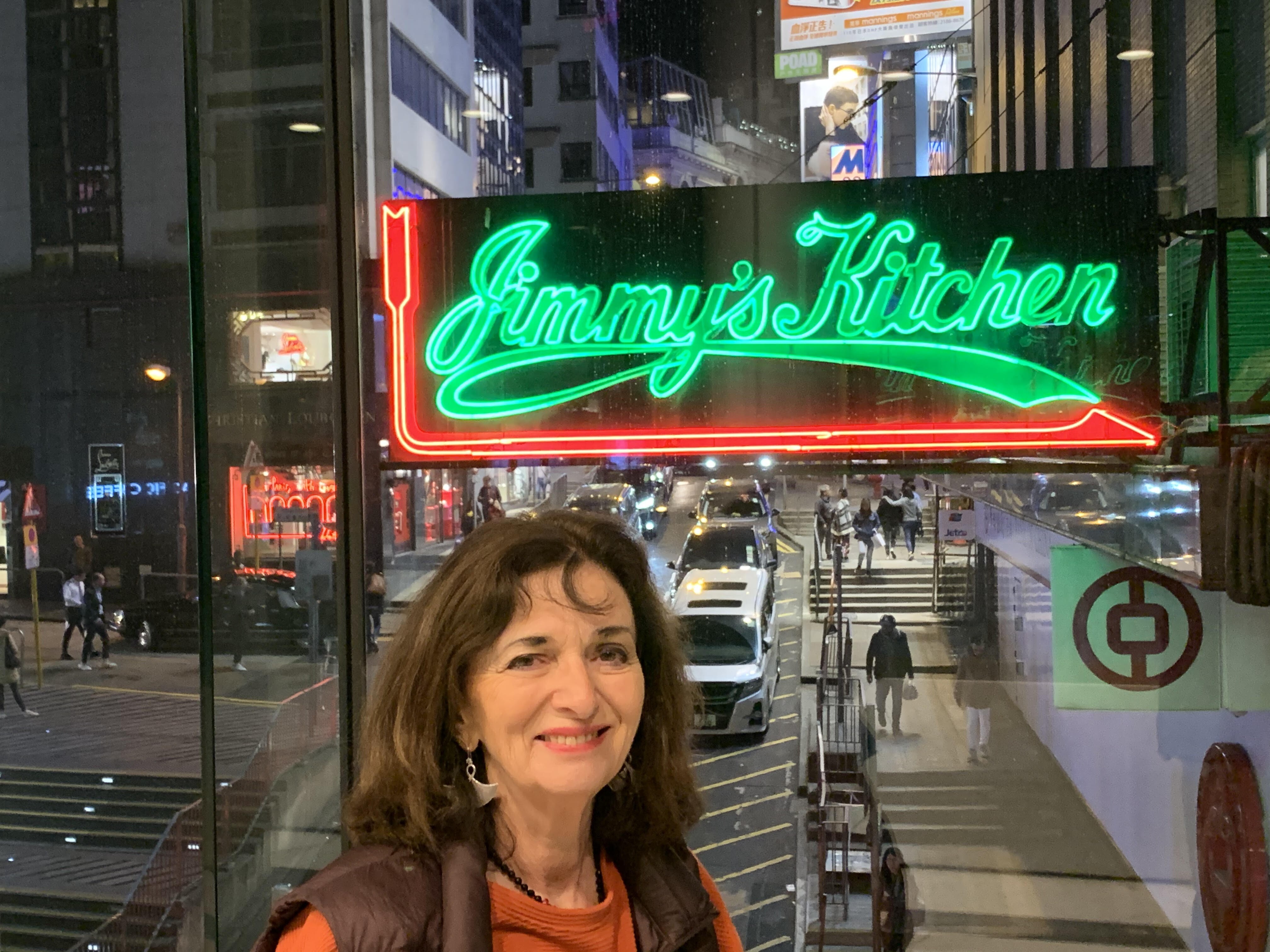Barbara Harding and the restaurant’s Wyndham Street sign. Photo: courtesy of Barbara Harding