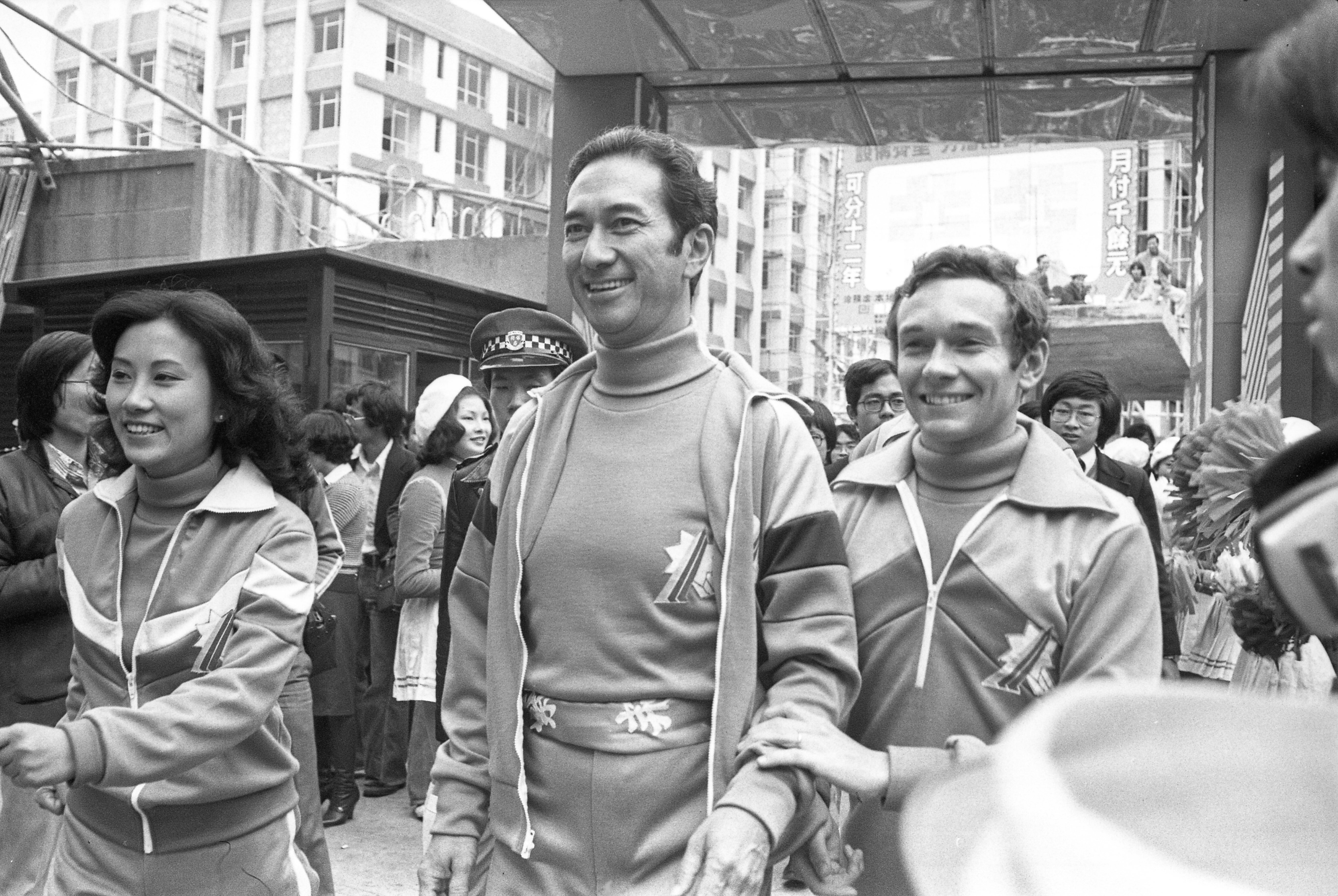 Stanley Ho, centre, and other celebrities are welcomed by cheerleaders and photographers at the finishing point of the Celebrity Relay Walkathon, a fund-raising event for the Community Chest, at the TVB headquarters in Hong Kong on January 29, 1978. Photo: SCMP