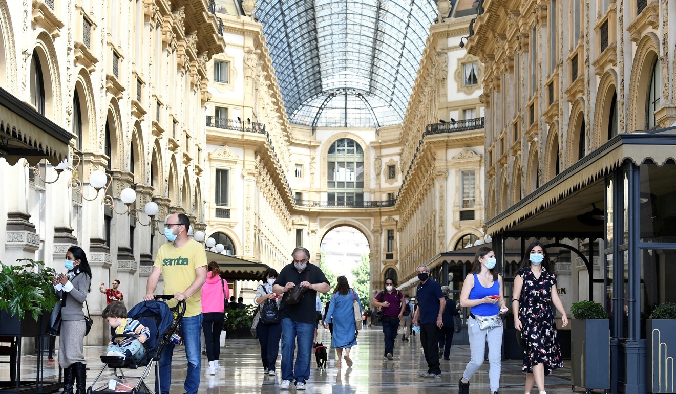Galleria Vittorio Emanuele II has a few visitors as Italy eases some of its lockdown measures. Photo: Reuters/Flavio Lo Scalzo
