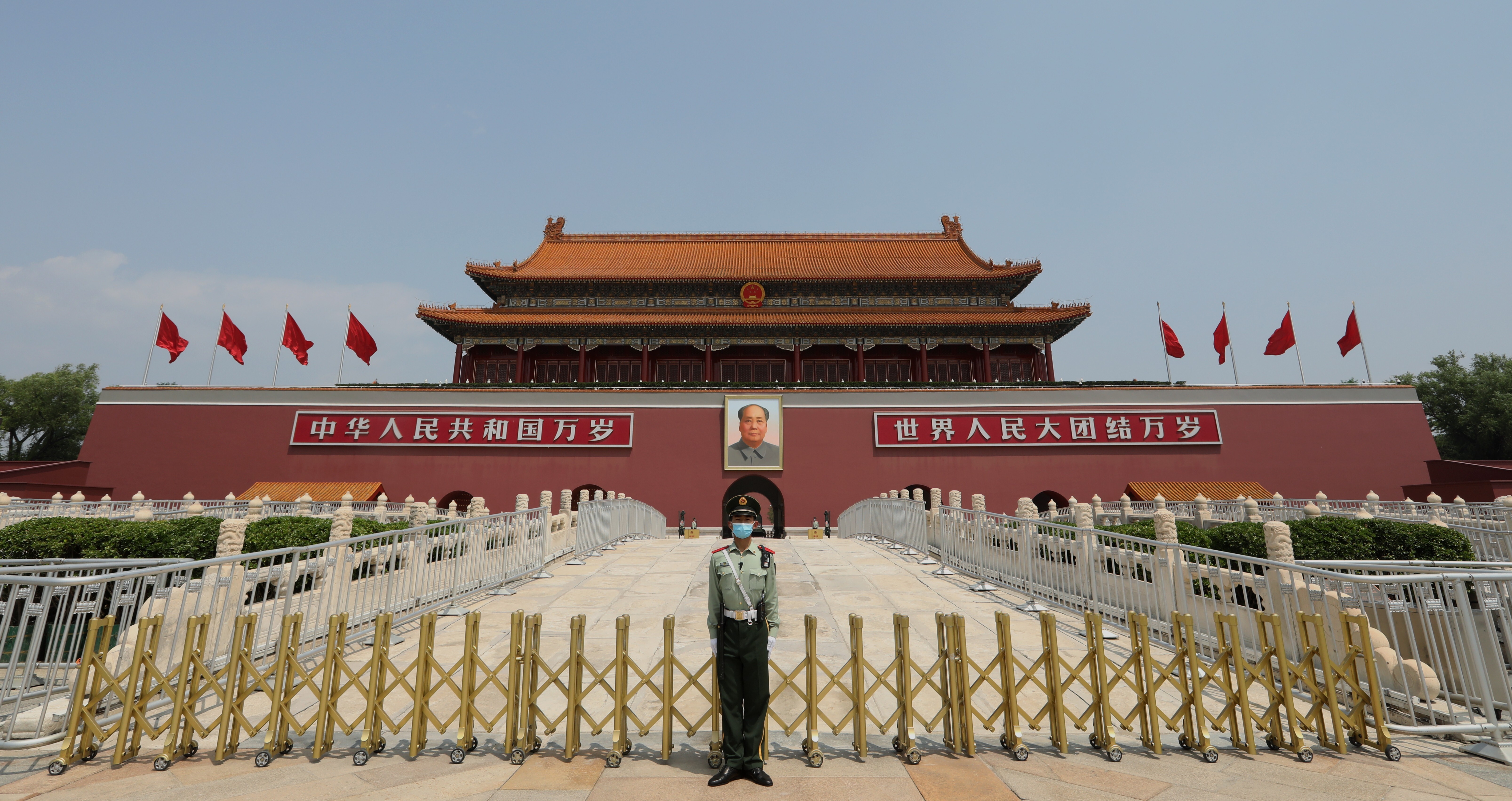 An armed policeman stands in front of the Tiananmen Rostrum in Beijing on May 22, the first day of the third session of the 13th National People’s Congress, China’s top legislative body. The central government submitted a resolution to the NPC to enable its standing committee to pass a new national security law tailor-made for Hong Kong. Photo: Simon Song