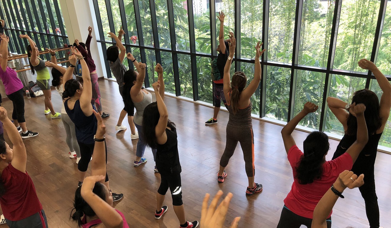 Domestic workers take a Zumba class in Singapore in 2018, before the age of coronavirus. Photo: ACMI Singapore