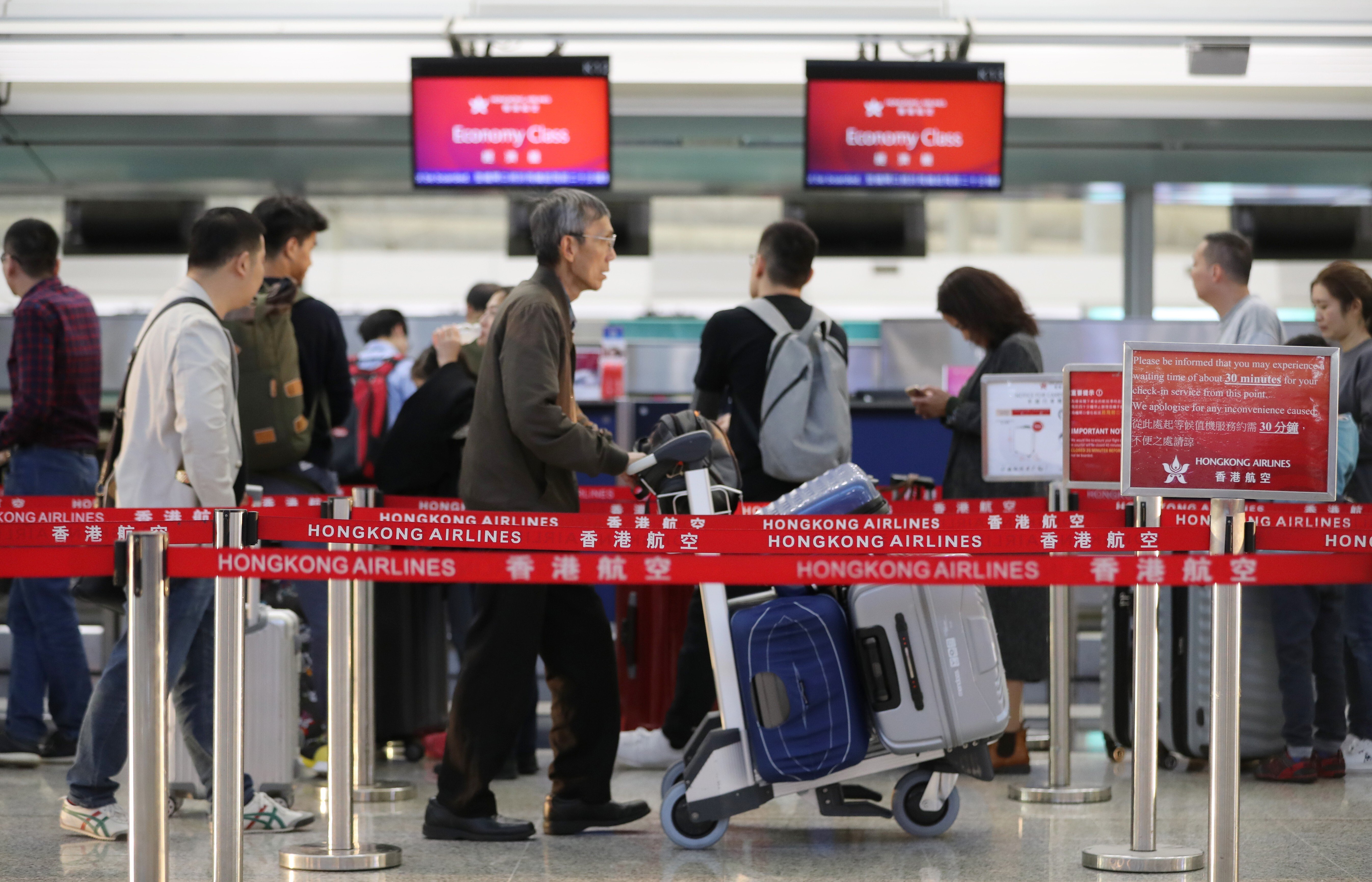 Passengers at the Hong Kong Airlines check in counter, Hong Kong International Airport, Chek Lap Kok on 29 November 2019. Photo: Edward Wong