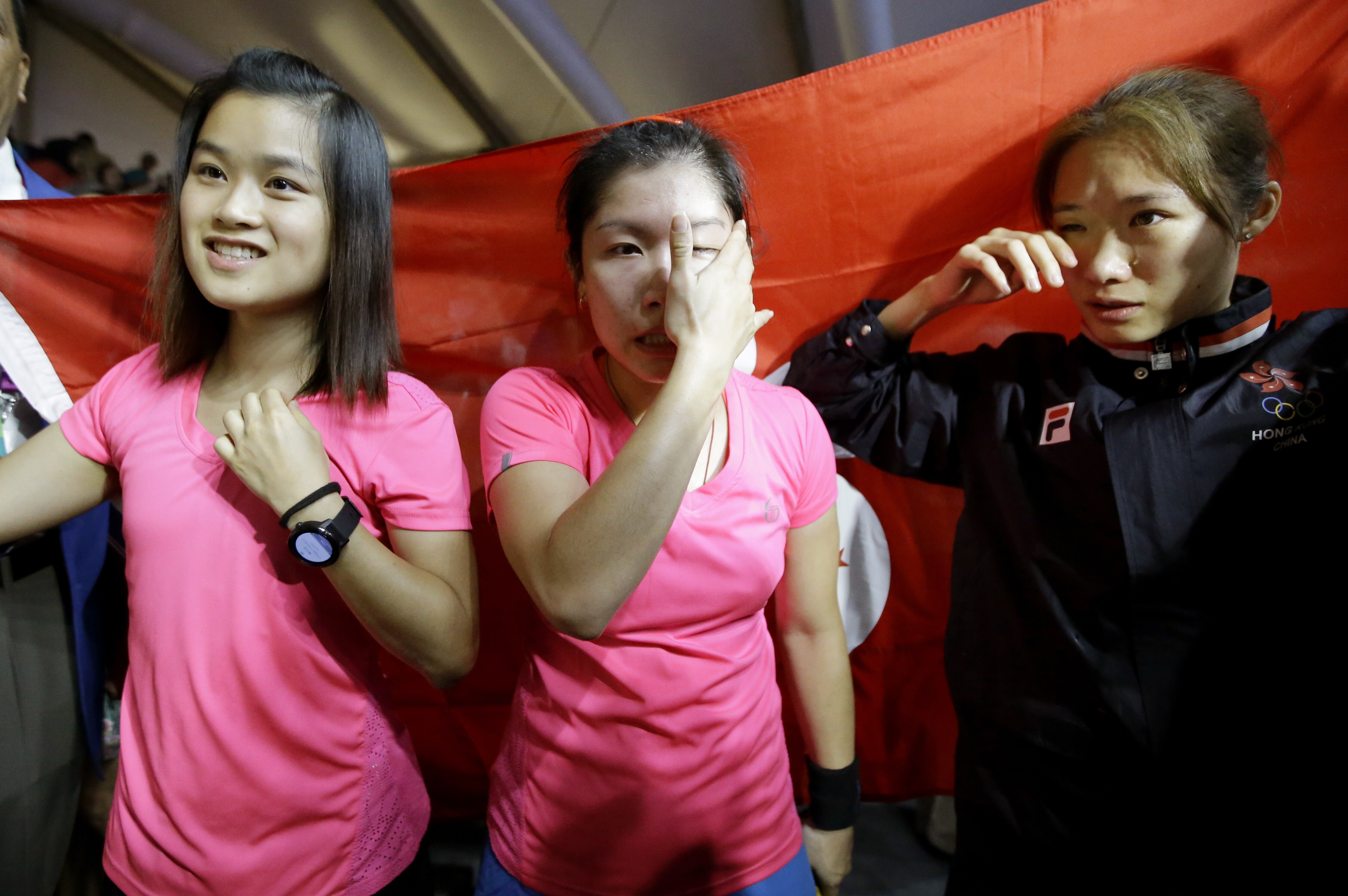 Annie Au (middle) and Joey Chan (right) shed tears of joy after winning the women’s team gold medal at the 2018 Asian Games. Au and Chan have now retired from the sport with Ho Tze-lok now leading the team. Photo: AP