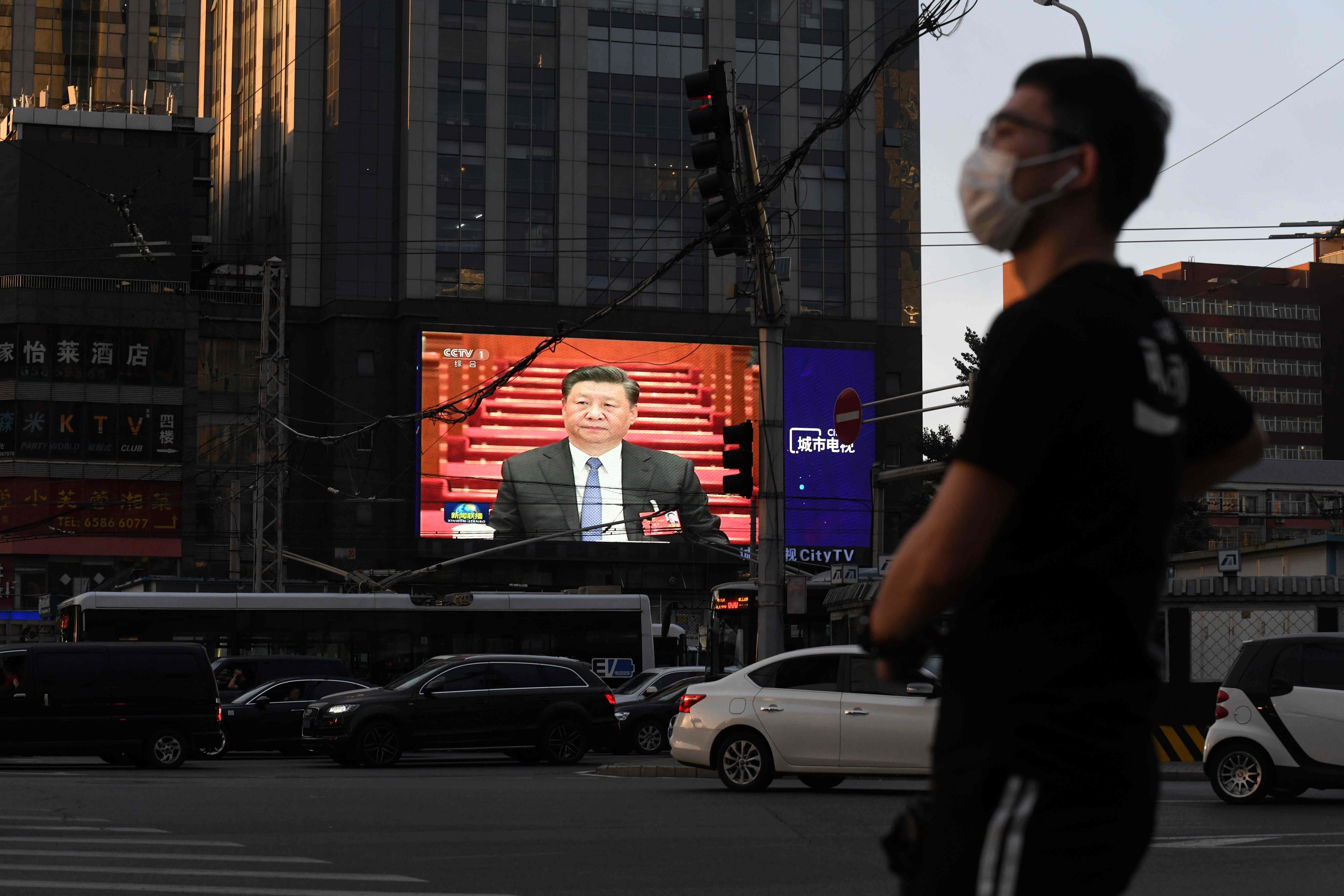 A giant screen in Beijing shows President Xi Jinping during the closing session of the National People’s Congress on May 28. Photo: AFP