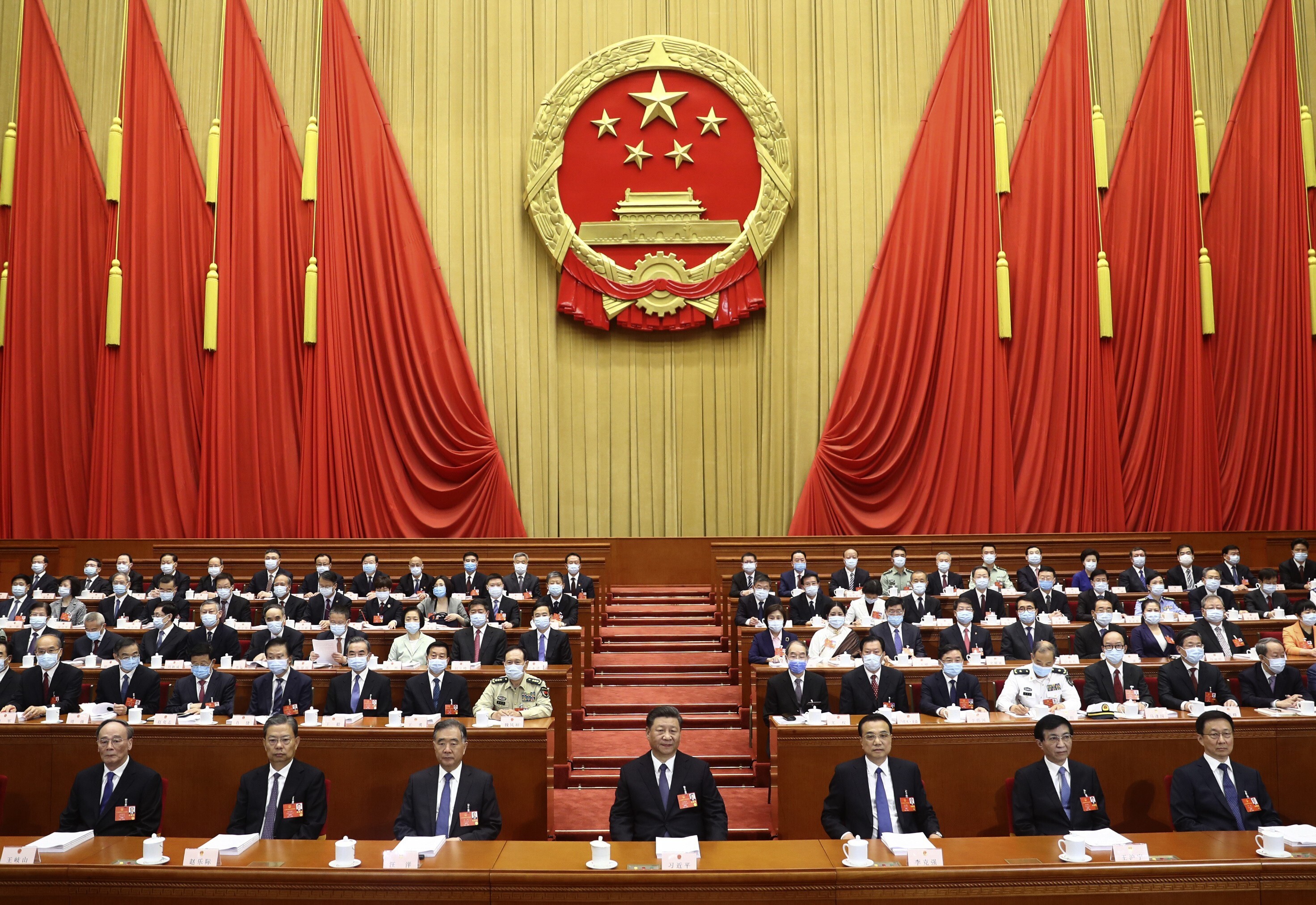 Chinese President Xi Jinping and other officials attend the opening session of the National People's Congress at the Great Hall of the People. Xi has crushed factional struggles in the CCP, but in so doing has created his own personal faction. Photo: Xinhua via AP