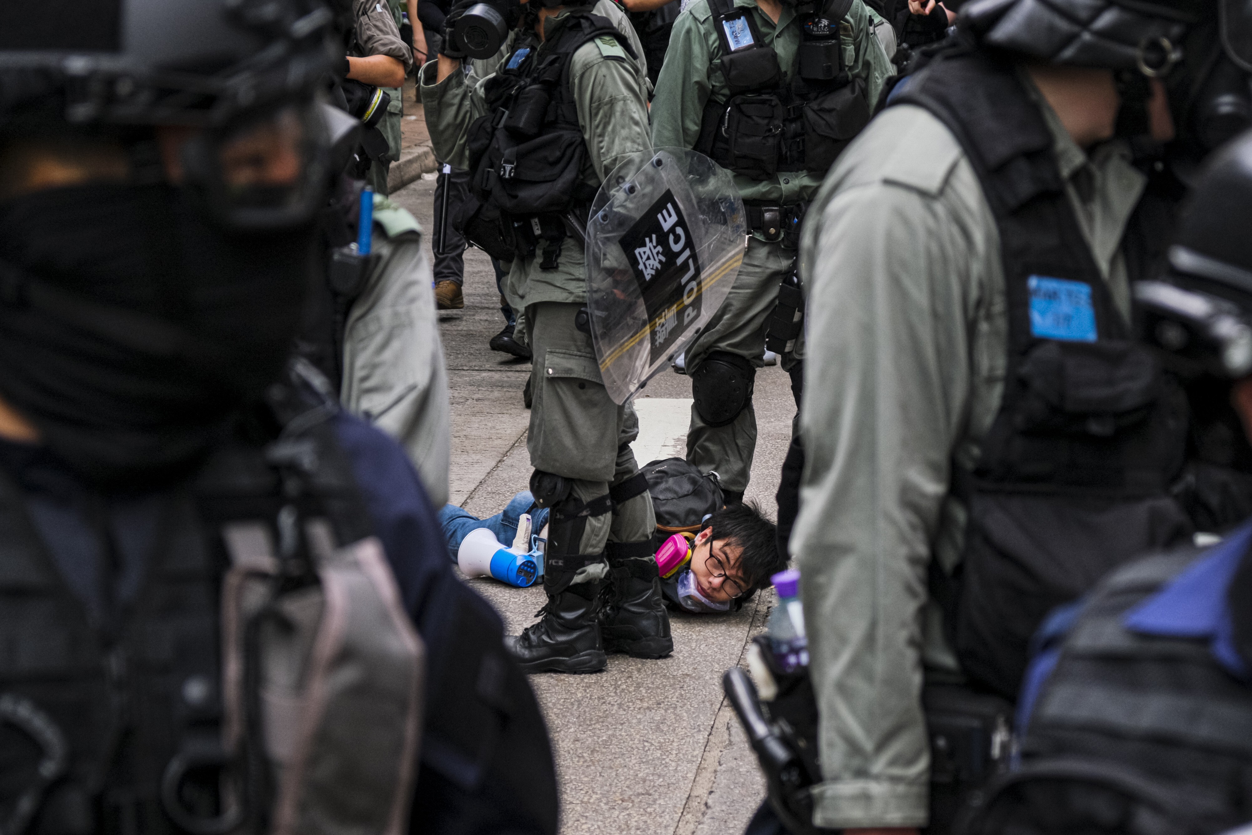 A demonstrator is arrested by police during a rally in Hong Kong on May 24 against a new national security law. Central government authorities have assured the people of the city that the new legislation will not effect the rights of law-abiding citizens. Photo: DPA