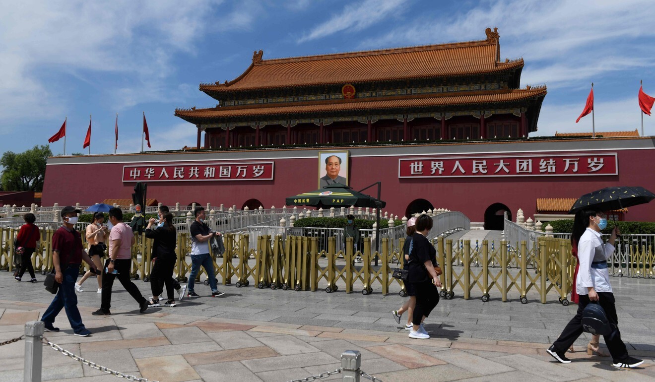 People walk past Tiananmen Gate in Beijing as the National People's Congress took place in the nearby Great Hall of the People in May. Photo: AFP