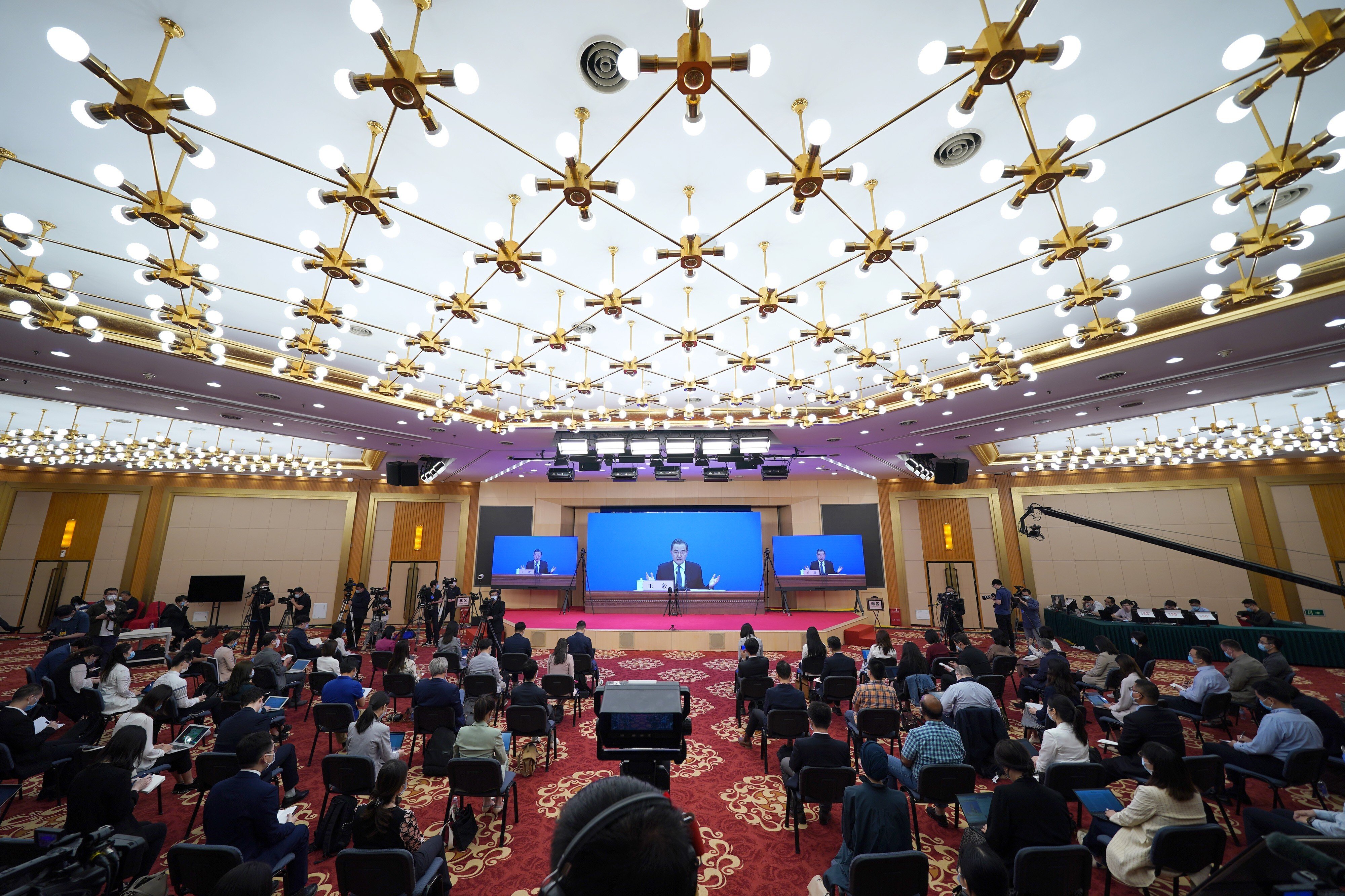 Simultaneous translation, in languages including English and French, is offered for a press conference given by Chinese Foreign Minister Wang Yi via video link in Beijing on May 24. Photo: Xinhua