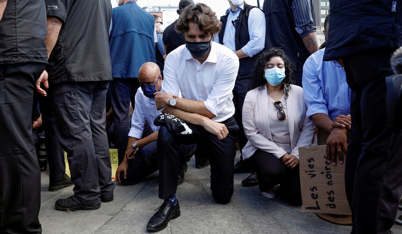 Canada's Prime Minister Justin Trudeau takes a knee in Ottawa on Friday during a rally against the death in Minneapolis police custody of George Floyd. Photo: Reuters