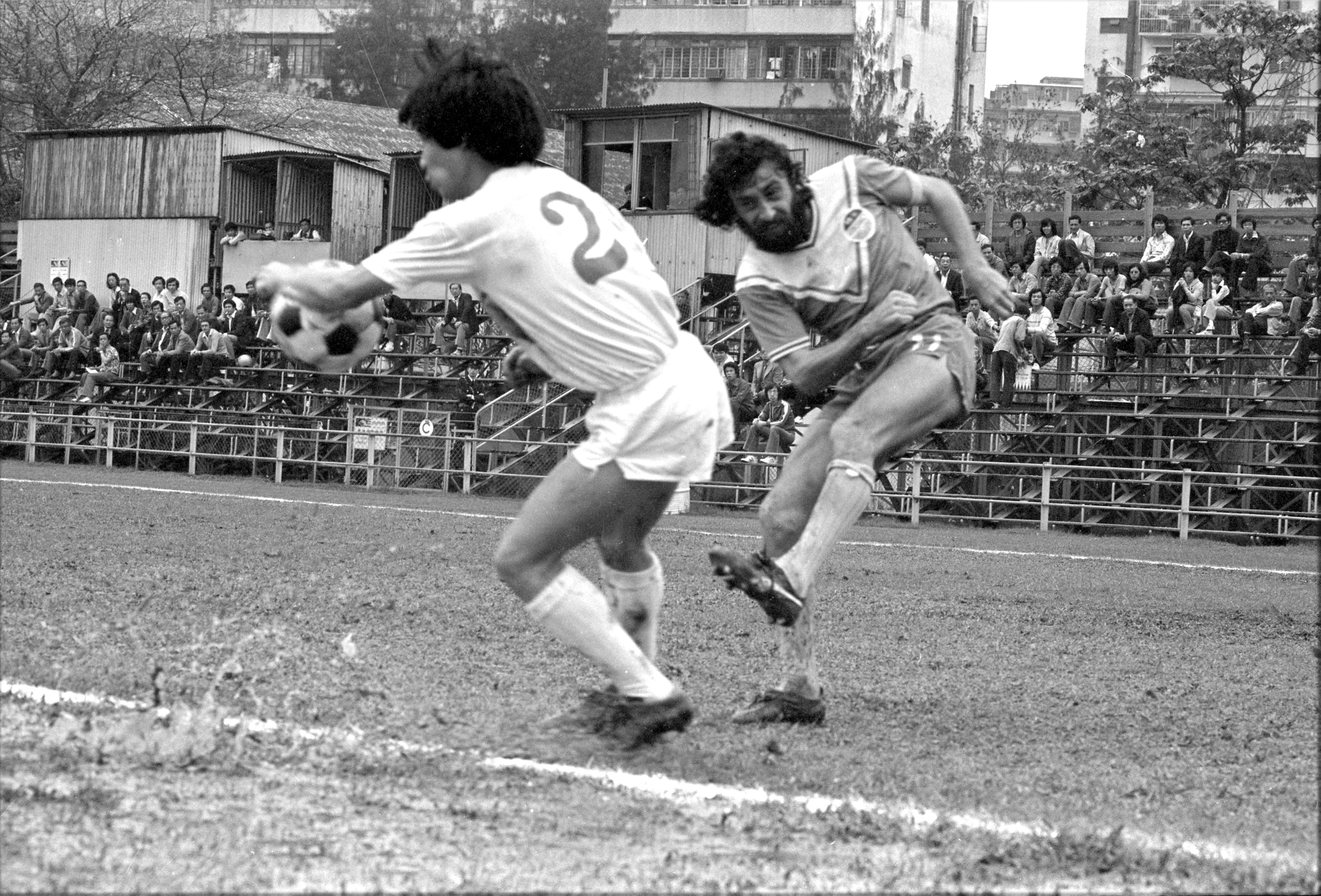 Seiko's Derek Currie (right) takes a shot but is blocked by Western Youth’s Cheung Chi-ming in a game played in April 1978. Photo: SCMP