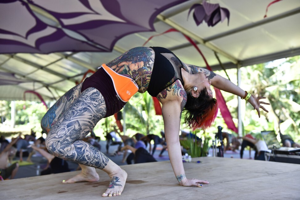 Singaporean yoga instructor Amanda Koh teaches a class during the 8th Bali Spirit Festival, in 2015. Photo: Getty Images