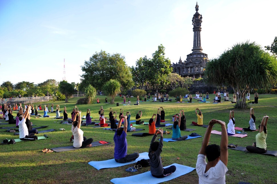 A yoga session near the Bajra Sandhi monument, in Bali. Photo: AFP