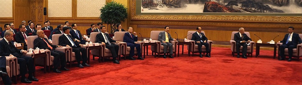 A 70-strong delegation of tycoons, business elites and professionals meet President Xi Jinping in the Great Hall of People on 21 September 2014. The tycoons sitting in the front row include (from left to right) Bank of East Asia chairman David Li Kwok-po; New World Development chairman Henry Cheng Kar-shun; K Wah Group chairman and Galaxy Entertainment Group founder Lui Che-woo; Wharf (Holdings) chairman Peter Woo Kwong-ching; Chairman of Kerry Group, Robert Kuok Hock Nien; Henderson Land Development chairman Lee Shau-kee; Cheung Kong (Holdings) chairman Li Ka-shing; and Tung Chee-hwa, a vice-chairman of CPPCC . Photo: Handout