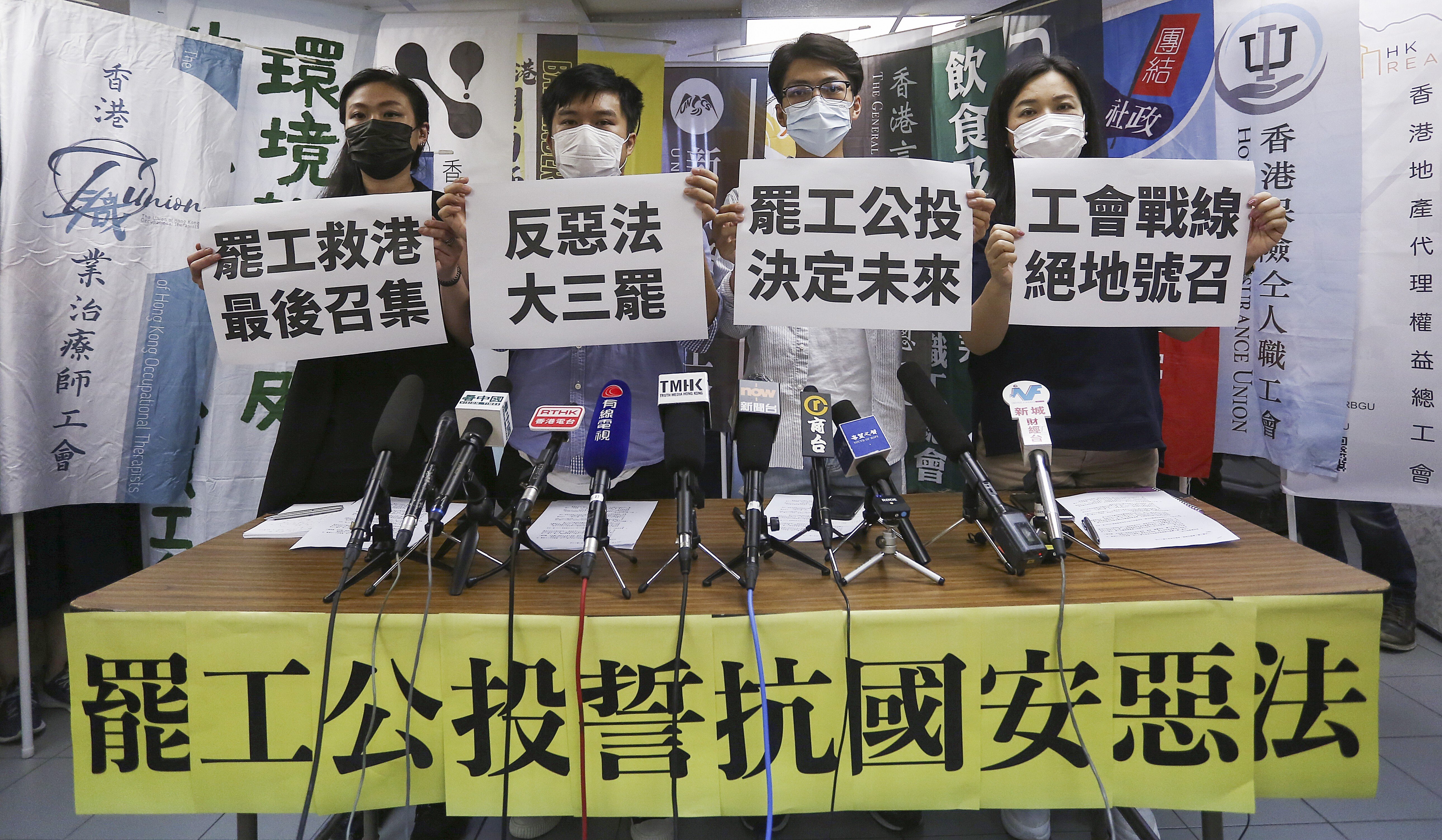 Organisers of the labour strike hold a press briefing, including (left to right) Cat Hou Chui-shan of the Bartenders & Mixologists Union; Alex Tang Cheuk-man of the Hong Kong Information Technology Workers’ Union; Alex Tsui of the Hong Kong Hotel Employees Union and Carol Ng of the Hong Kong Confederation of Trade Union. Photo: Jonathan Wong
