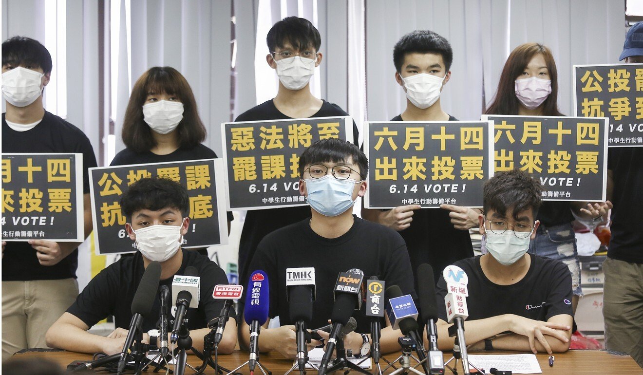 Students, including Carson Tsang Long-hin of Ideologist (front row, left) and Isaac Cheng of the Hong Kong Secondary Schools Actions Platform (front row, middle) hold a press briefing on the proposed strike. Photo: Jonathan Wong