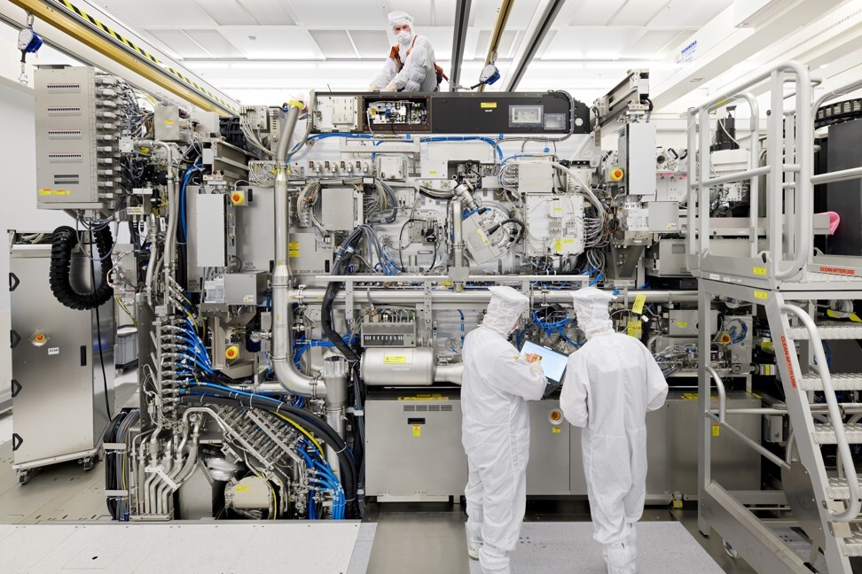 Employees of ASML are seen working on the final assembly of the company’s Twinscan NXE: 3400B extreme ultraviolet semiconductor lithography equipment with its panels removed, in Veldhoven, the Netherlands, in April of last year. Photo: Reuters