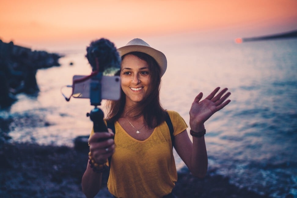 Now is the ideal time to learn the basics of vlogging for when international borders finally reopen. Photo: Getty Images