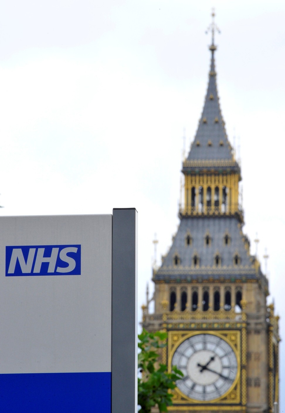 A sign of Britain’s National Health Service (NHS) is seen in the grounds of St Thomas' Hospital, in front of the Houses of Parliament in London. The NHS’ project with Palantir Technologies is expected to help the government tackle the coronavirus pandemic. Photo: Reuters