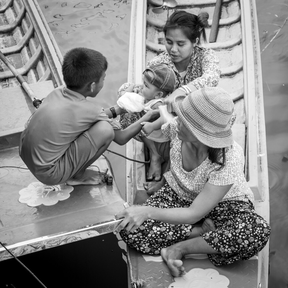Women and children arrive at a TLC clinic. Unless seriously ill or injured, working-age men will be too busy fishing and tending nets to see a doctor. “These people live by the day,” says TLC’s Dr Hun Thourida. “What they catch is all they have.” Photo: Gary Jones