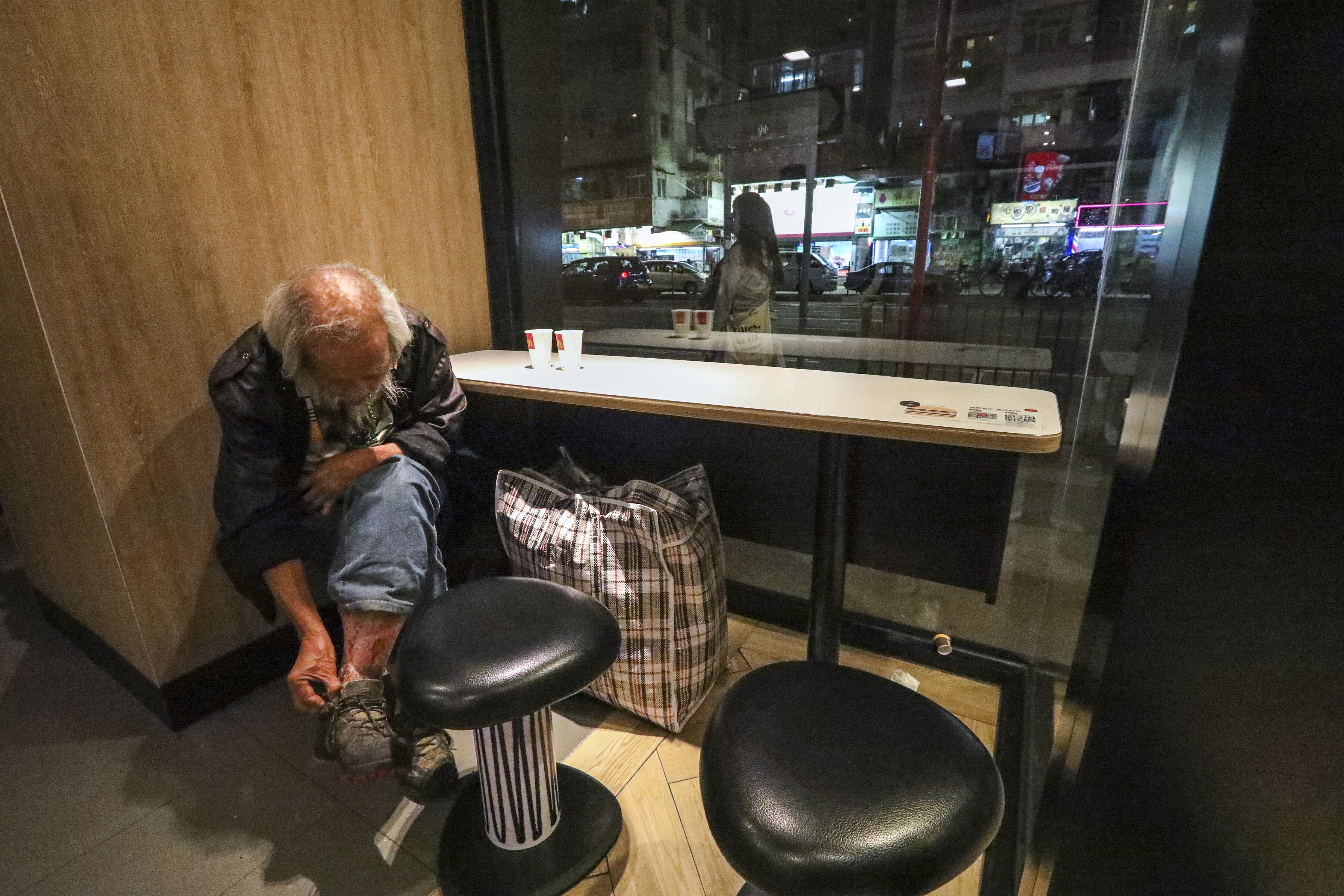 An elderly diner at a fast-food restaurant in Hong Kong’s Sham Shui Po district in December 2019. One in three elderly people in Hong Kong lives in poverty. Photo: Felix Wong